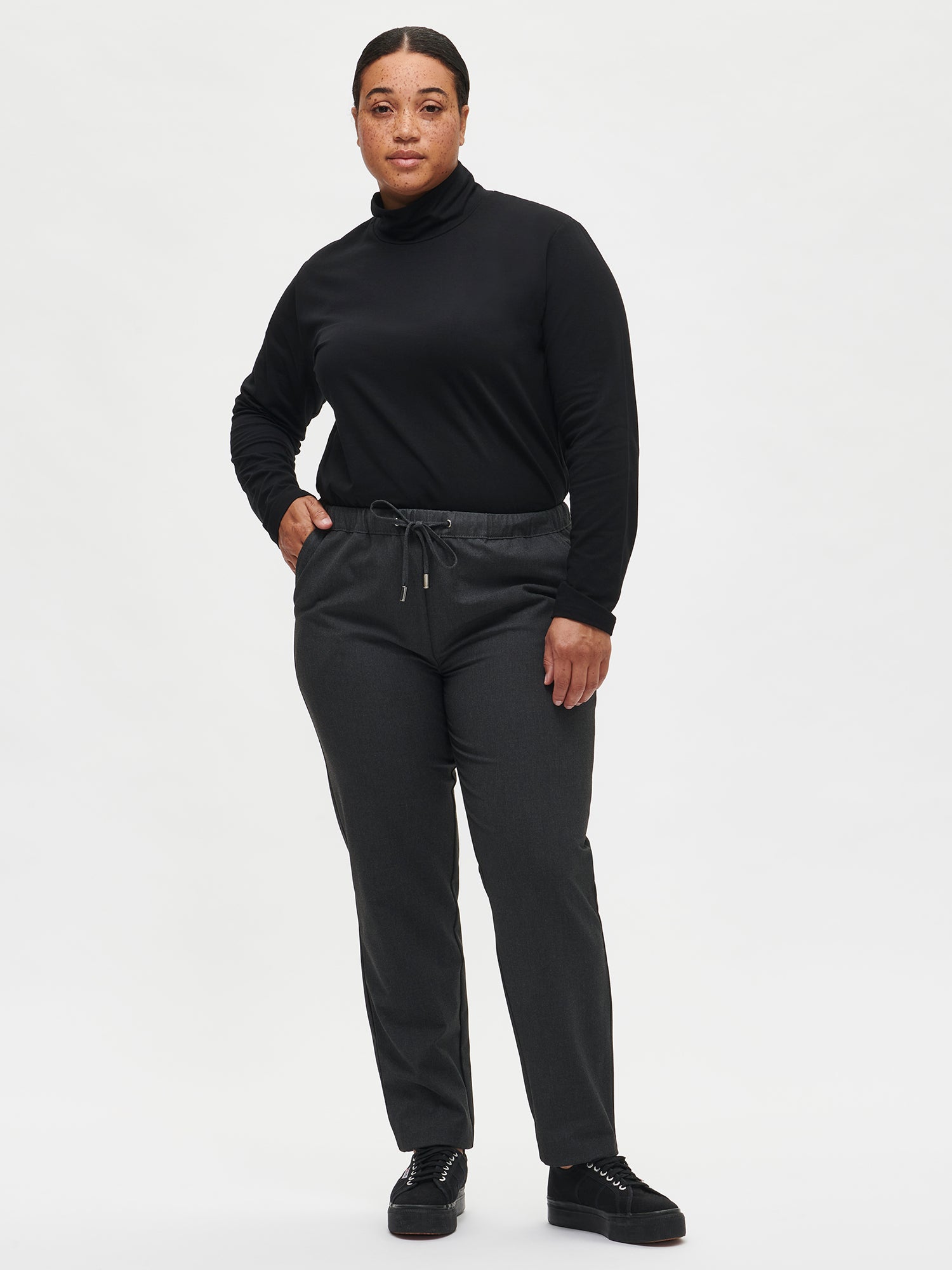 Women's Mari turtleneck in black on a model