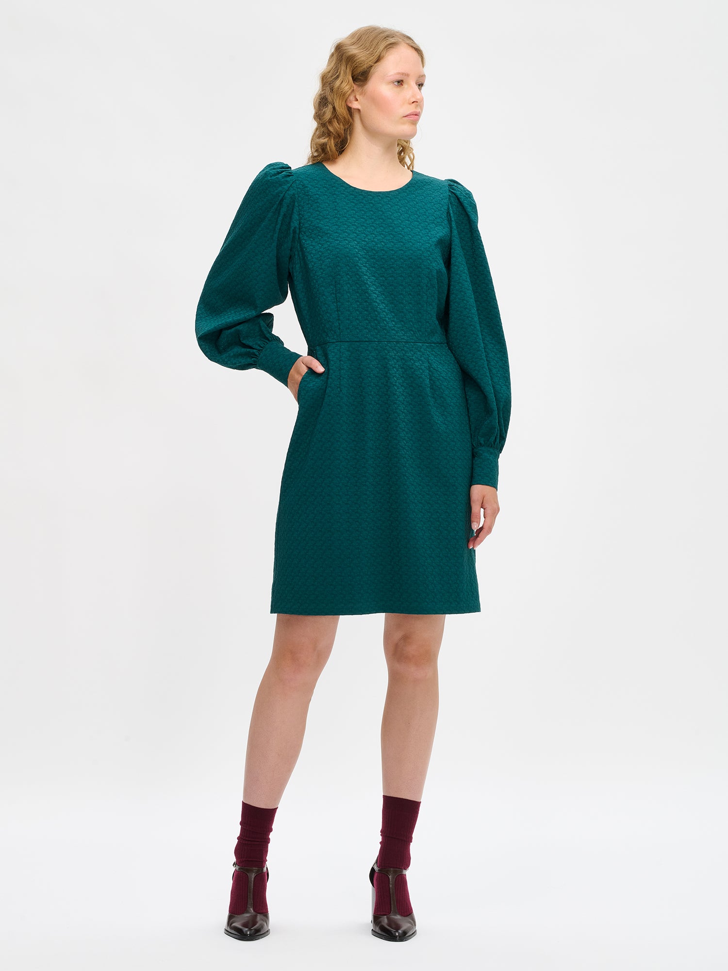 Nanso's elegant dark green Reliefi dress for women features a stylish design, front