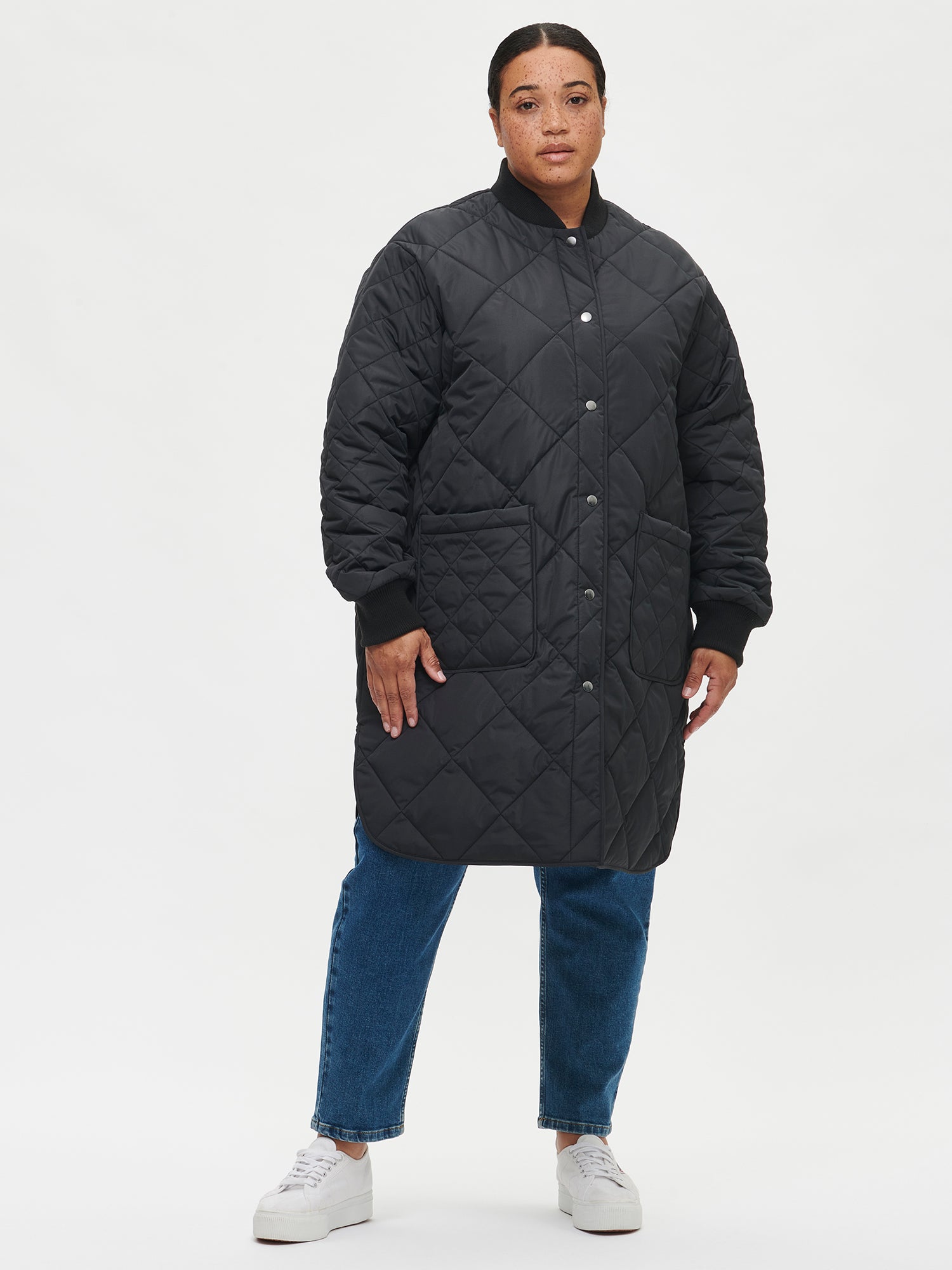 Nanso women's casual black Midi quilted coat on a model with jeans | XL - 172cm