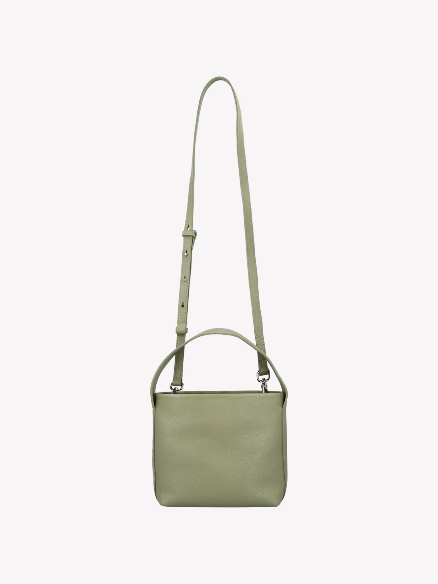 Nanso women’s versatile light green leather bag with a detachable shoulder strap and a top handle – carry it your way, every day. Product picture from the front.