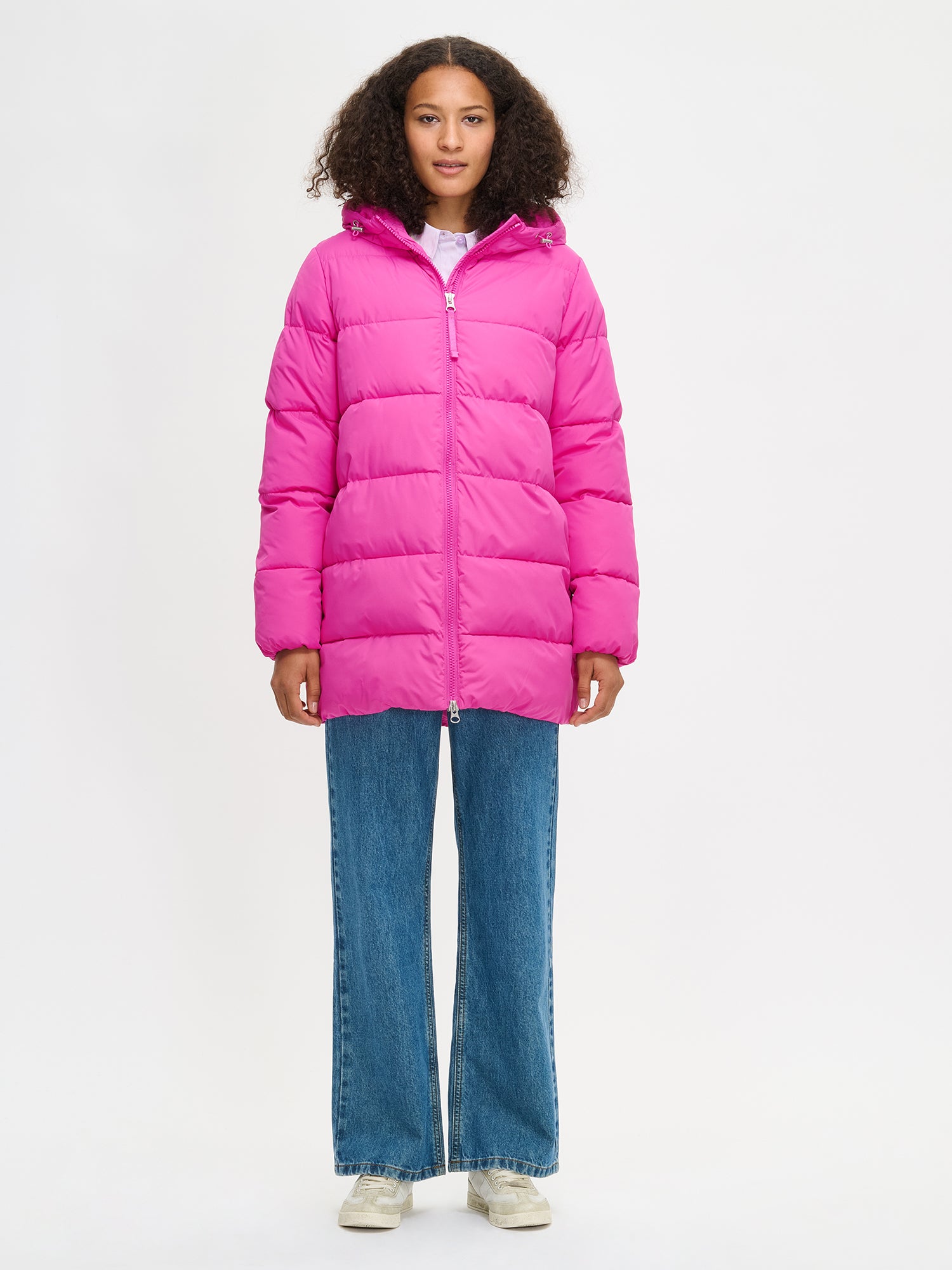 The pink Lumi padded coat provides warmth with its soft, lightweight padding and generous fit. worn by a model in size S. 