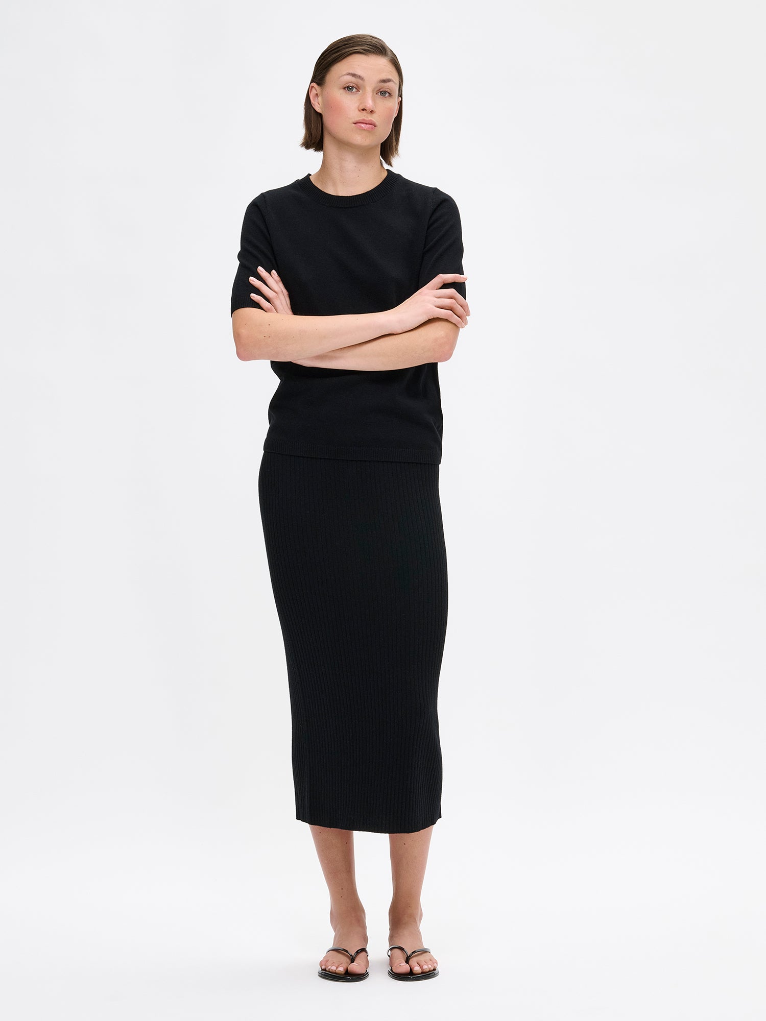 Black Villis ribbed knit skirt and sweater on a model
