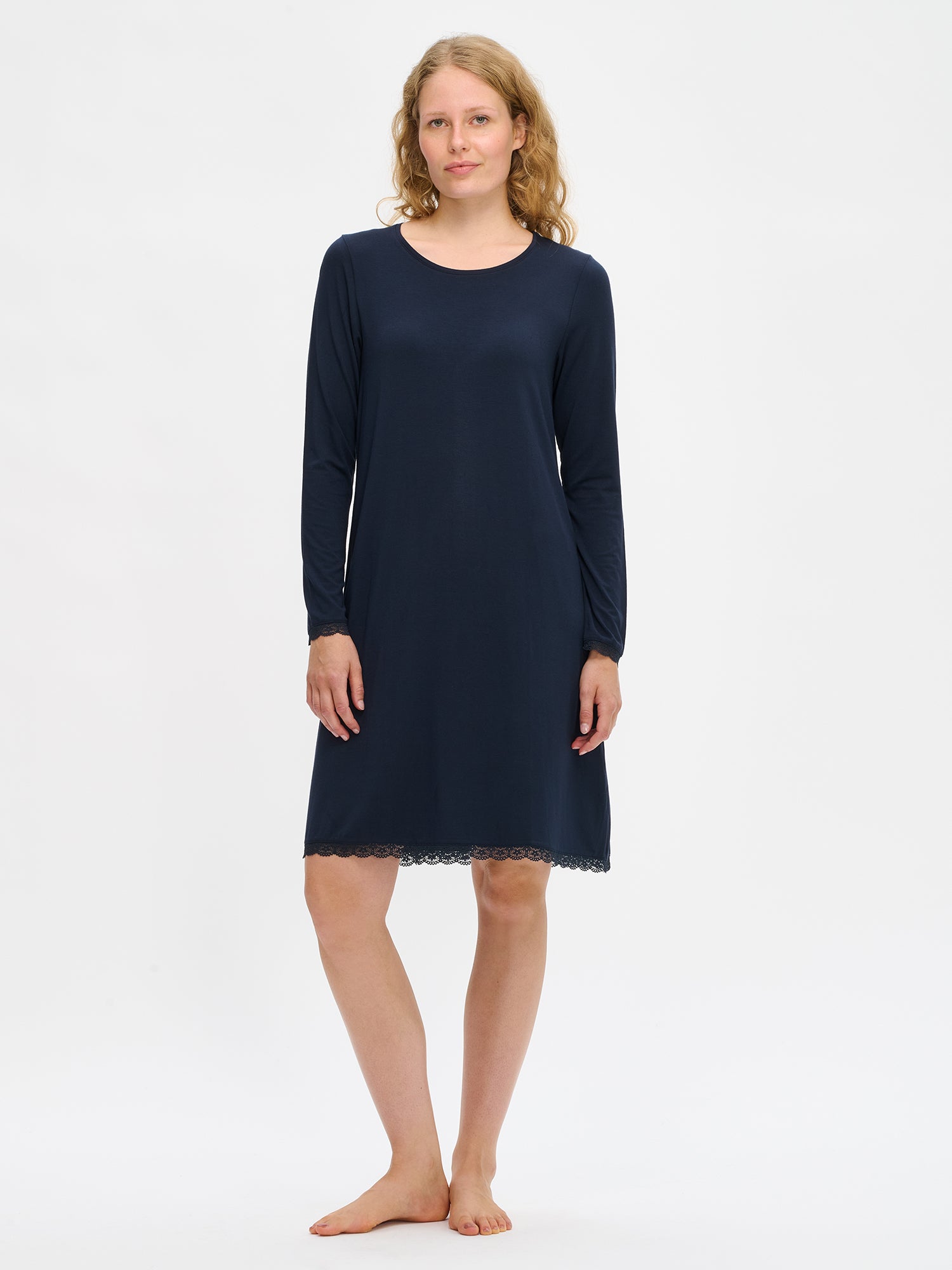 Dark blue Pitsi nightgown with long sleeves and a round neckline on a model. 