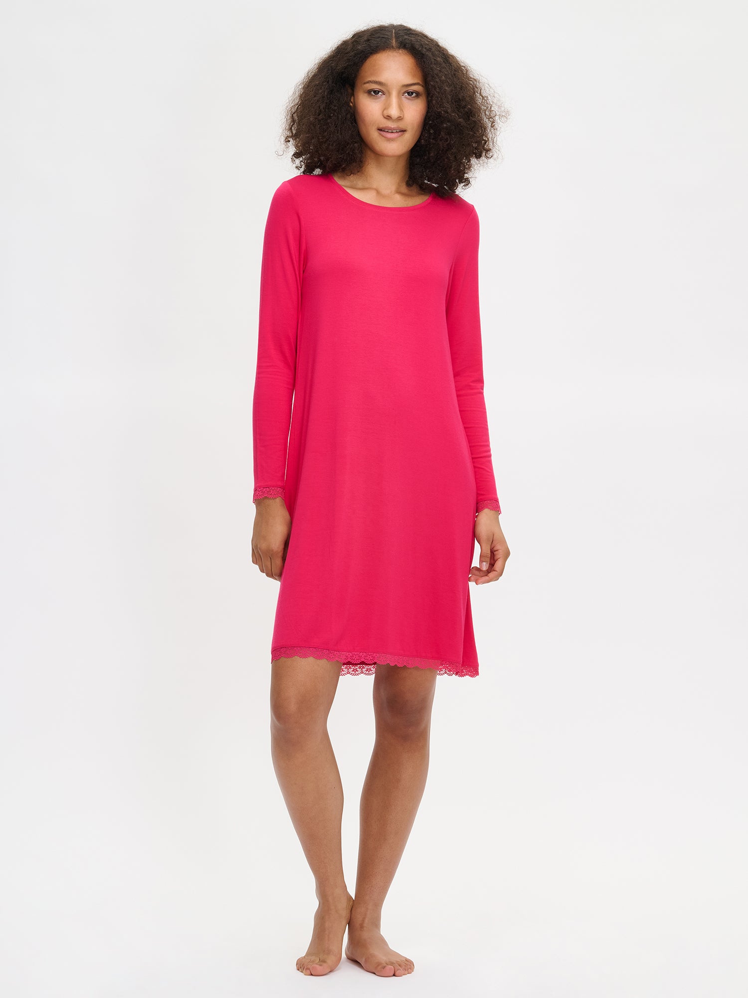 Pink Pitsi nightgown with long sleeves and a round neckline on a model. 