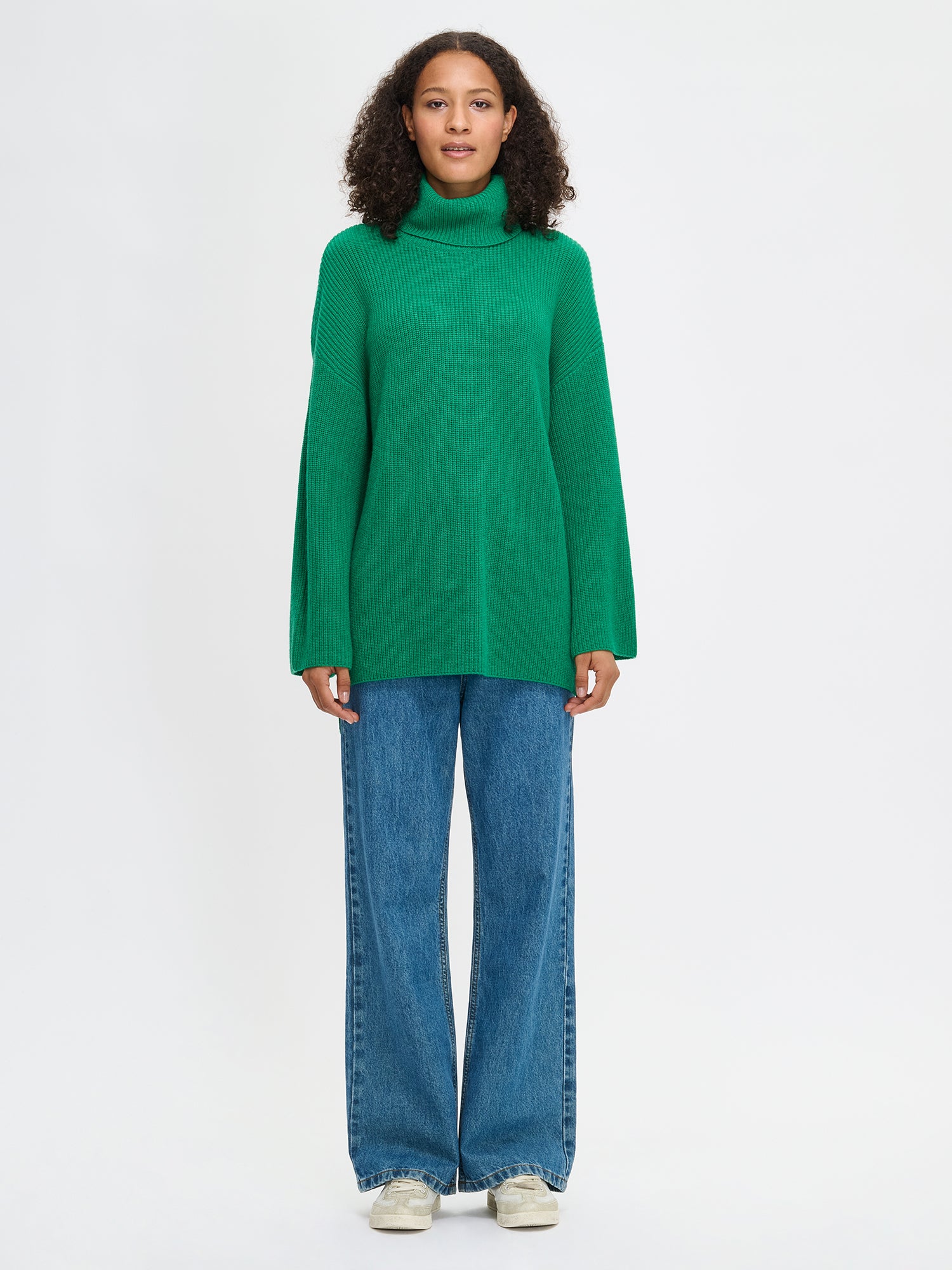Nanso's relaxed green Pamela knit tunic, front