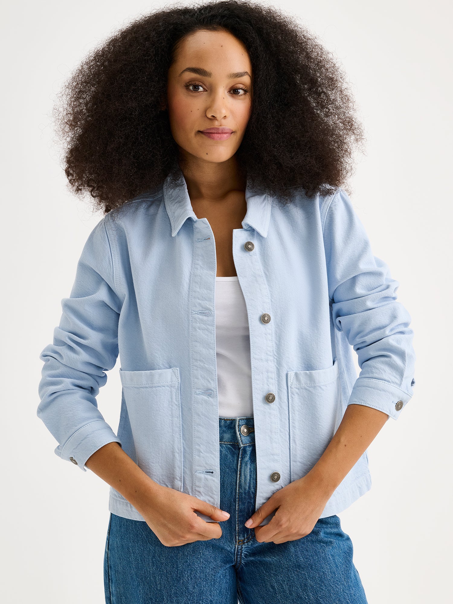 Nanso women's relaxed short MIMI jacket in a beautiful blue shade on a model with jeans.