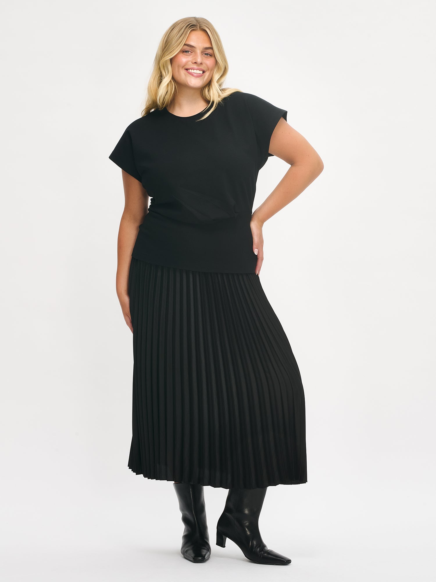 Nanso's elegant Taite skirt for women features a graceful drape in a classic black in size XL