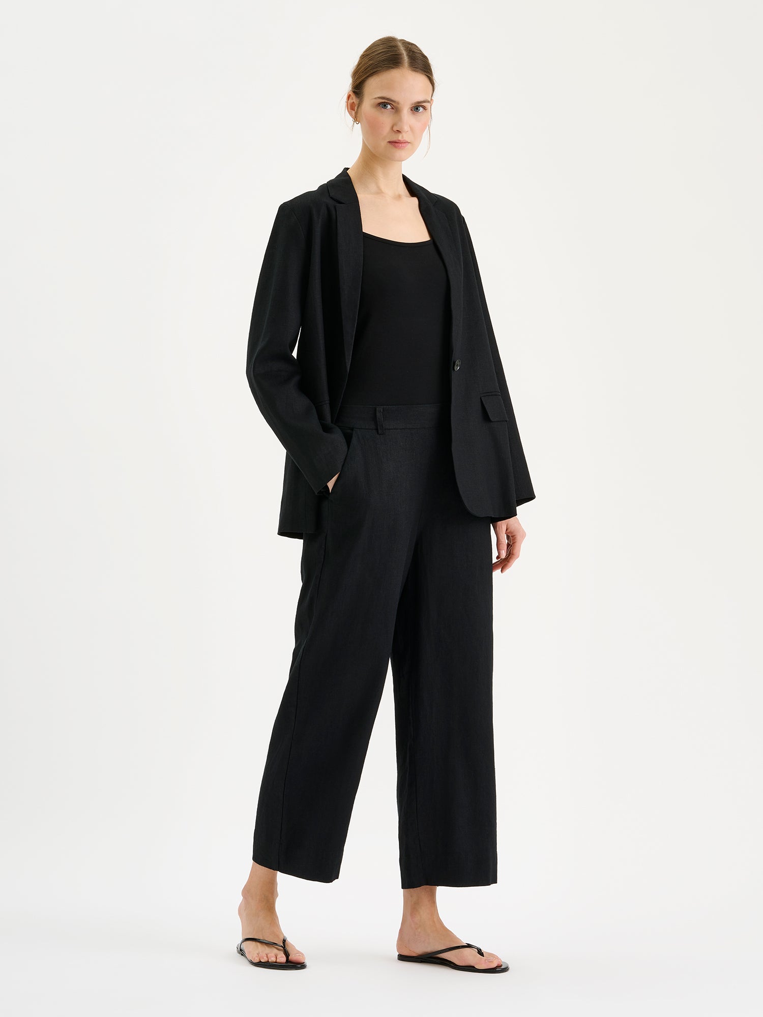 Nanso women's Arles black blazer on a model with Saari culottes