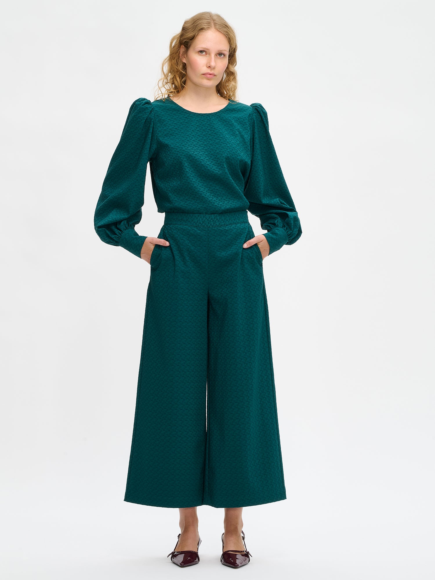 Nanso's stylish women's blouse in dark green features a beautiful textured surface, front