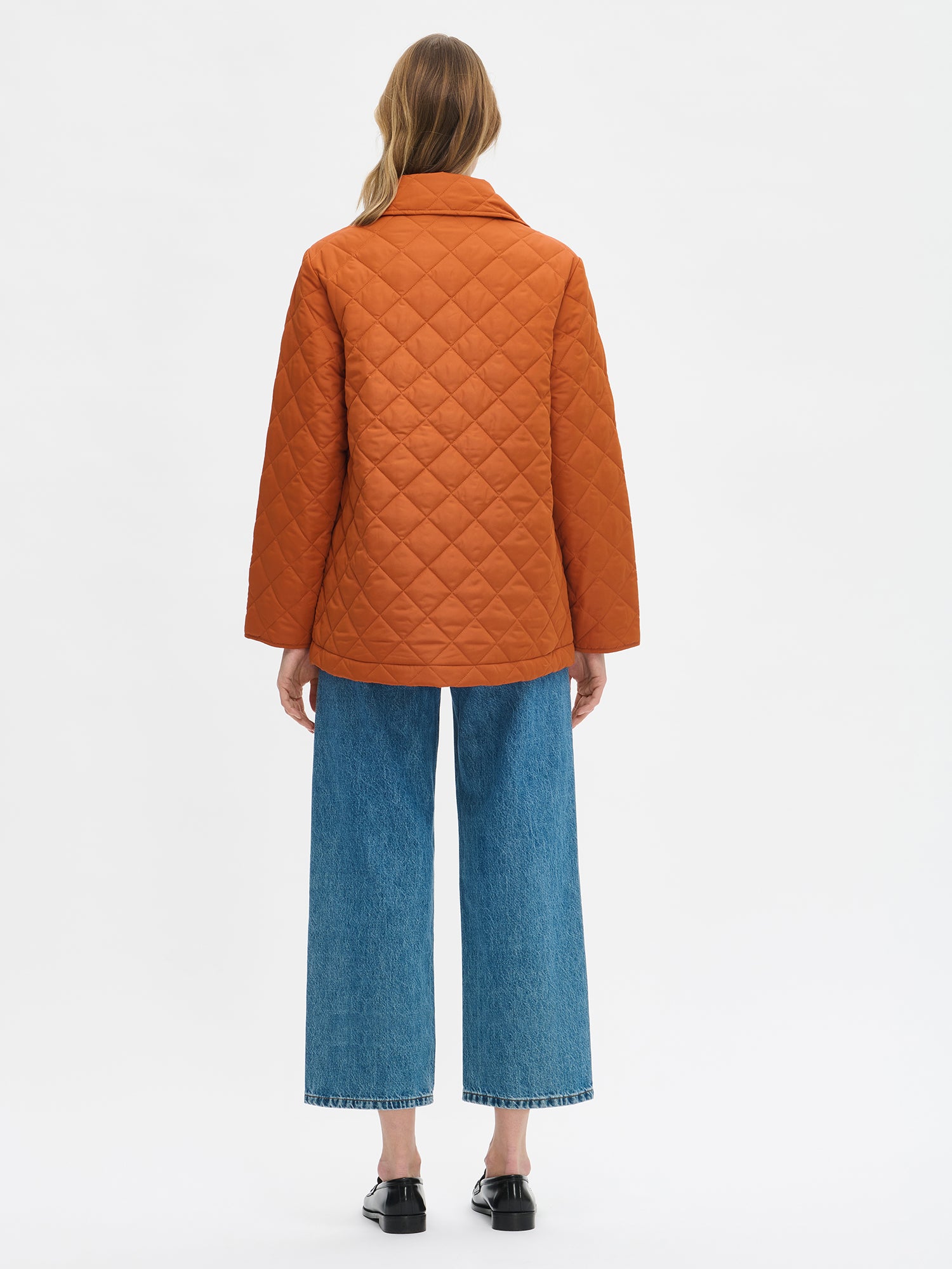 Nanso women's blue Cropped Levee jeans styled with a jacket