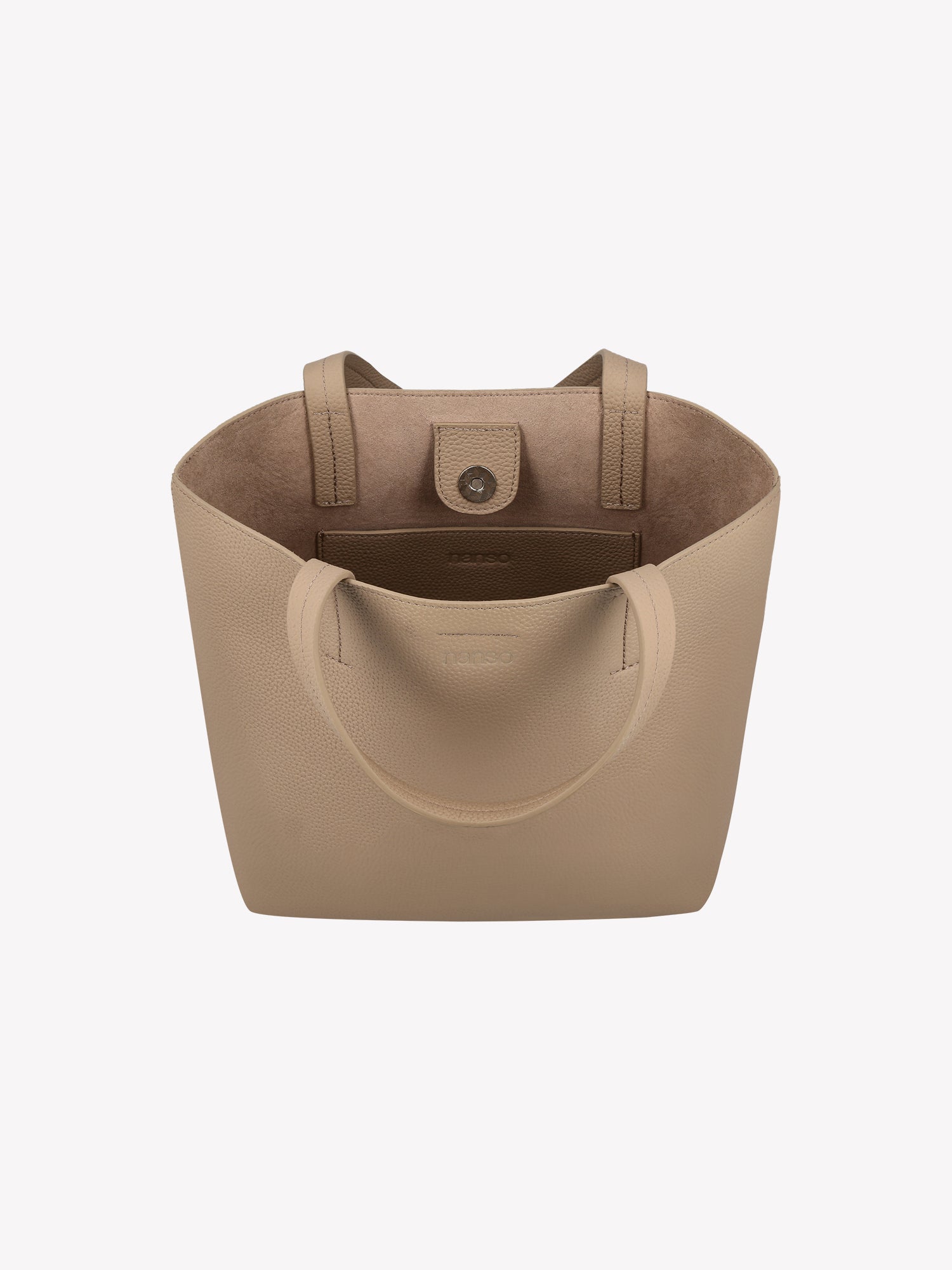 Nanso elegant light beige Naru Tote leather bag. The Naru Tote features both short carry handles and a longer, adjustable and detachable shoulder strap. Product picture from above, with a view to the inside of the bag.