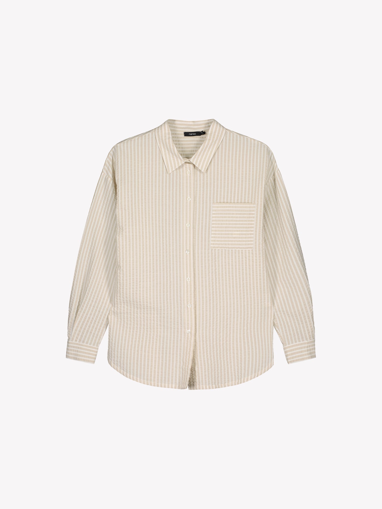 Nanso women's Marea Shirt in beige features a classic button-up shirt with a timeless and striped pattern. The shirt includes a collar, dropped shoulder line, chest pocket, and front buttons. Product picture from the front.