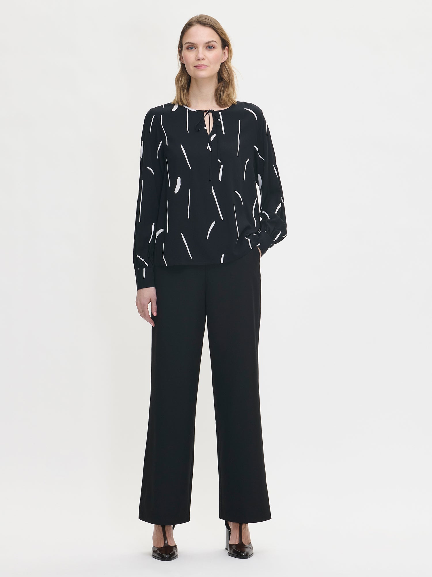 Nanso women's patterned black and white Sivellin blouse, on a model