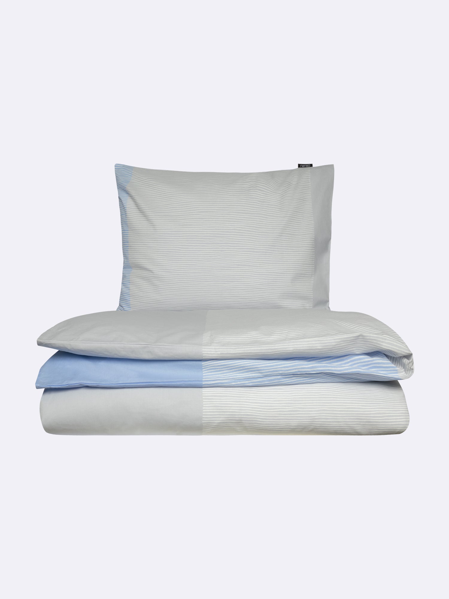 Nanso home's Viiru duvet cover set in light blue, folded.