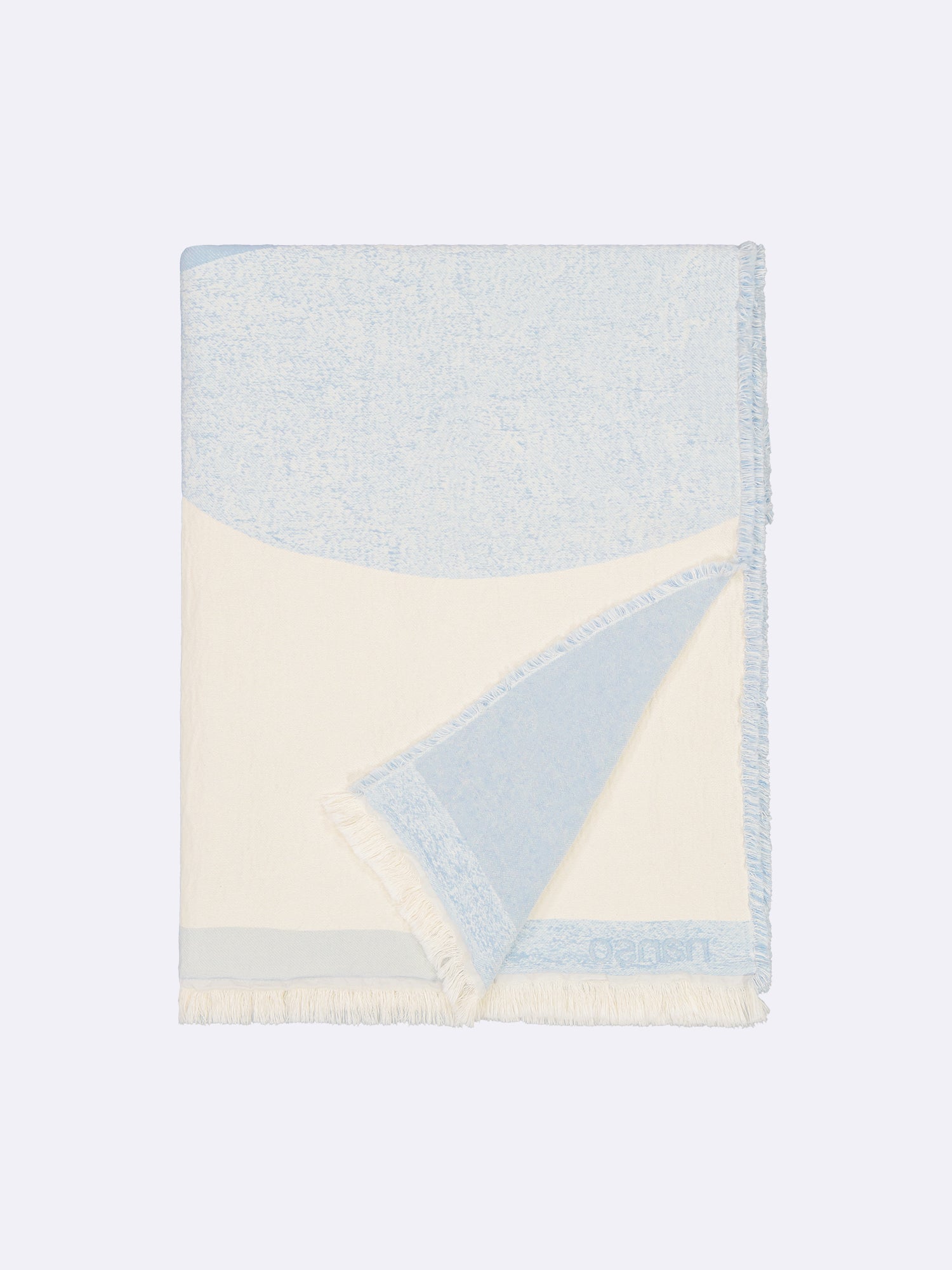 Nanso home's KUUTIO blanket folded open corner.