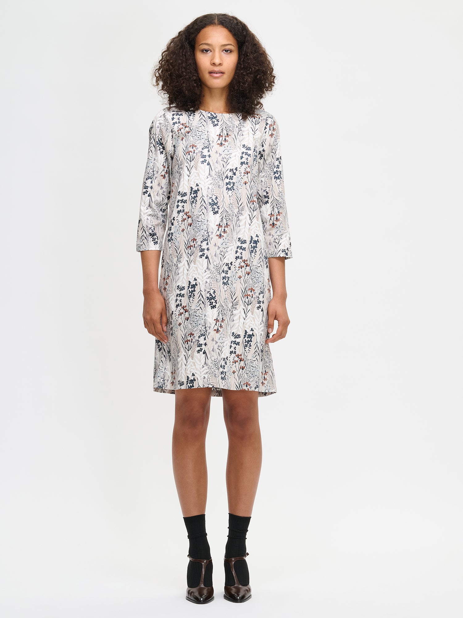 Women's Kuutamo dress in neutral color. Worn by a model in size S.