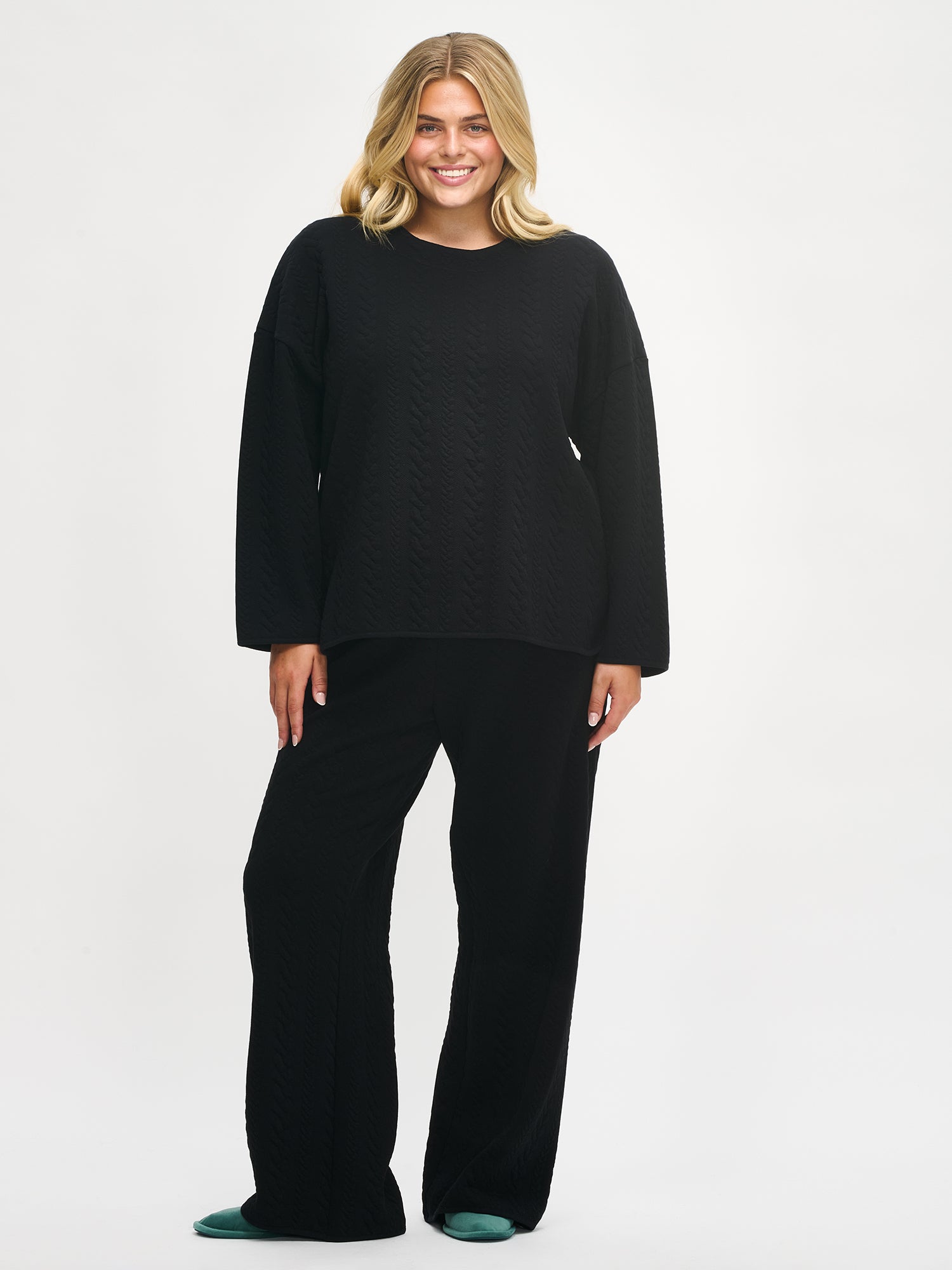 Women´s Letti blouse in black, worn by a model in size XL.