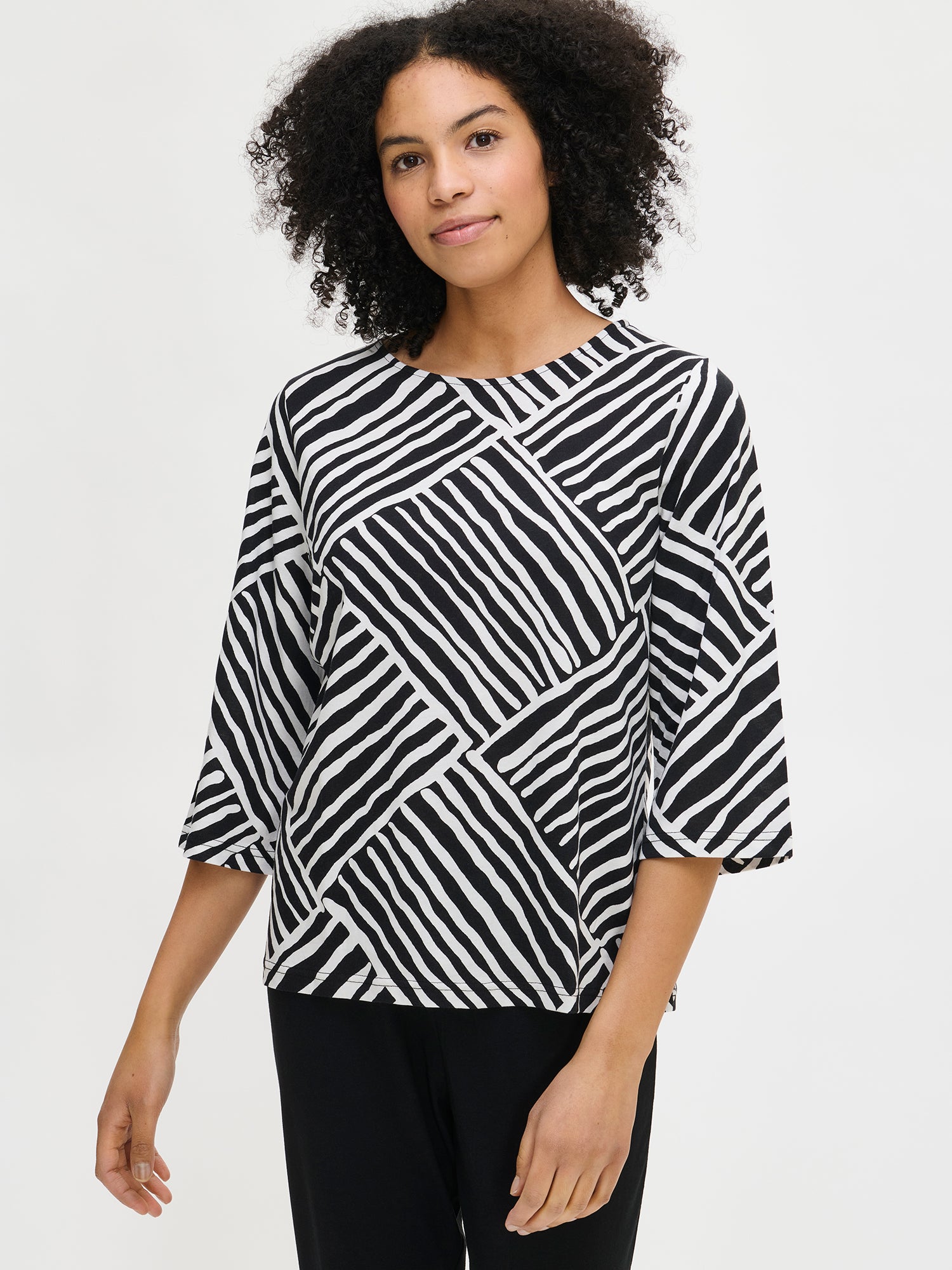 The pajama's shirt has 3/4 sleeves and an oval neckline as show in the picture by the model.