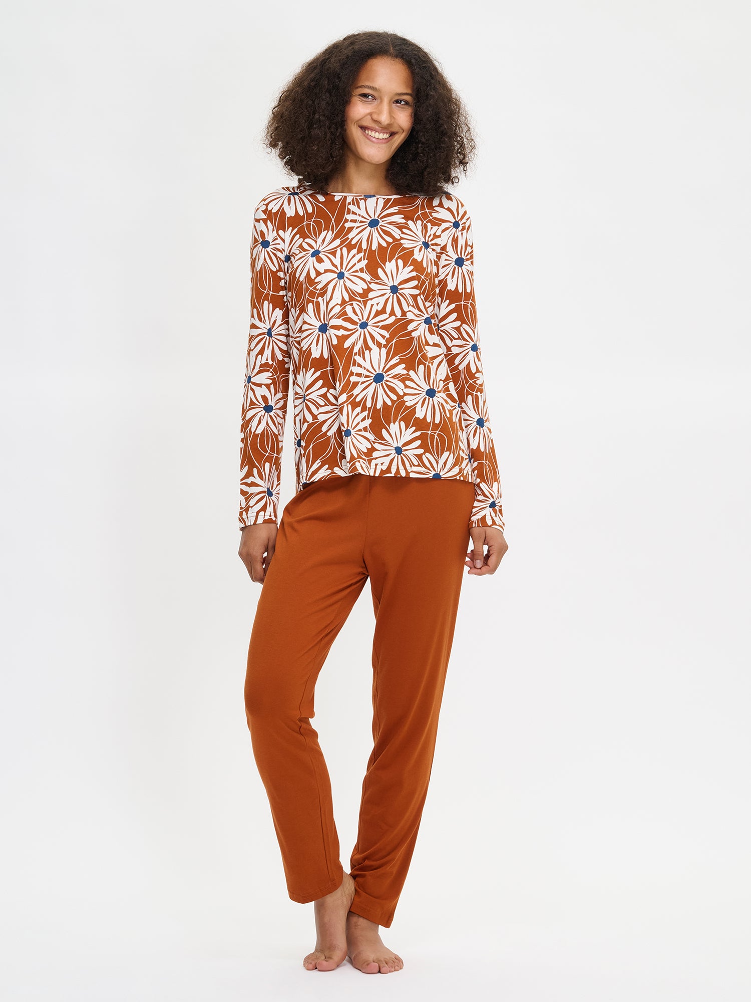 Anette floral pajama set in brown on a model.