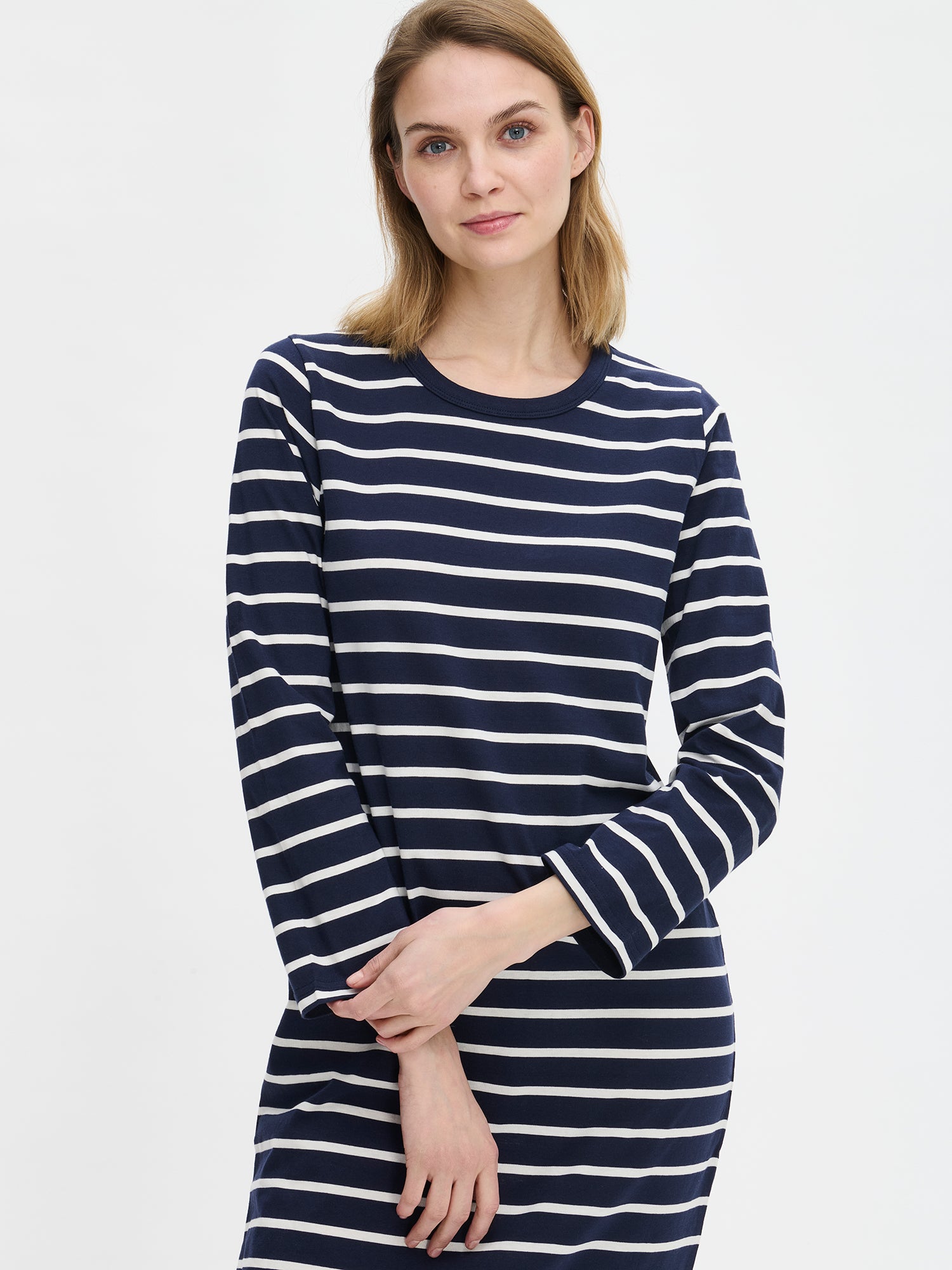 Women’s long Duetto nightgown with blue and white stripes has full-length sleeves and a round neckline as shown in this close-up photo.