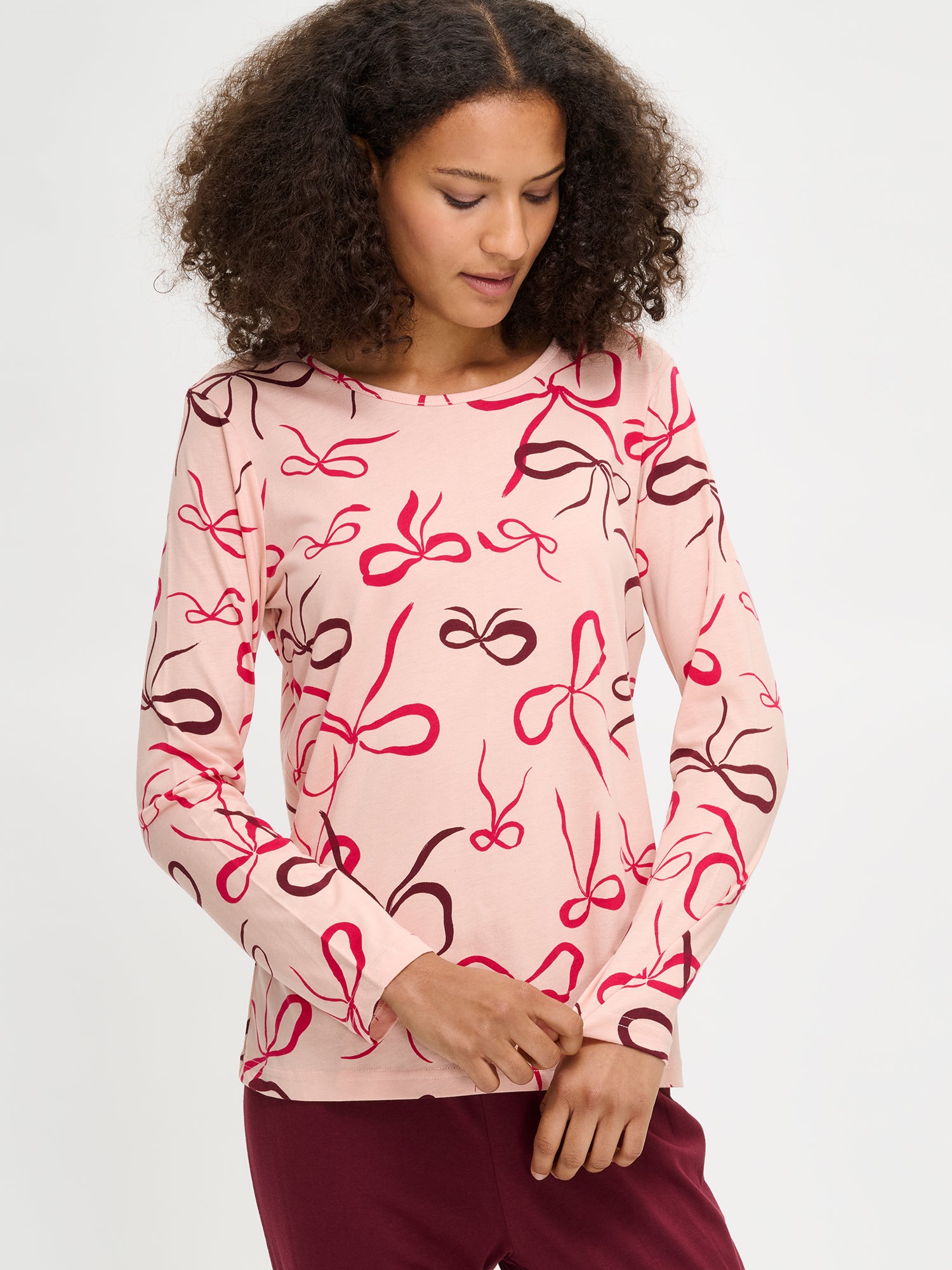 The Rusetti pajama top with long sleeves on a model in the picture.