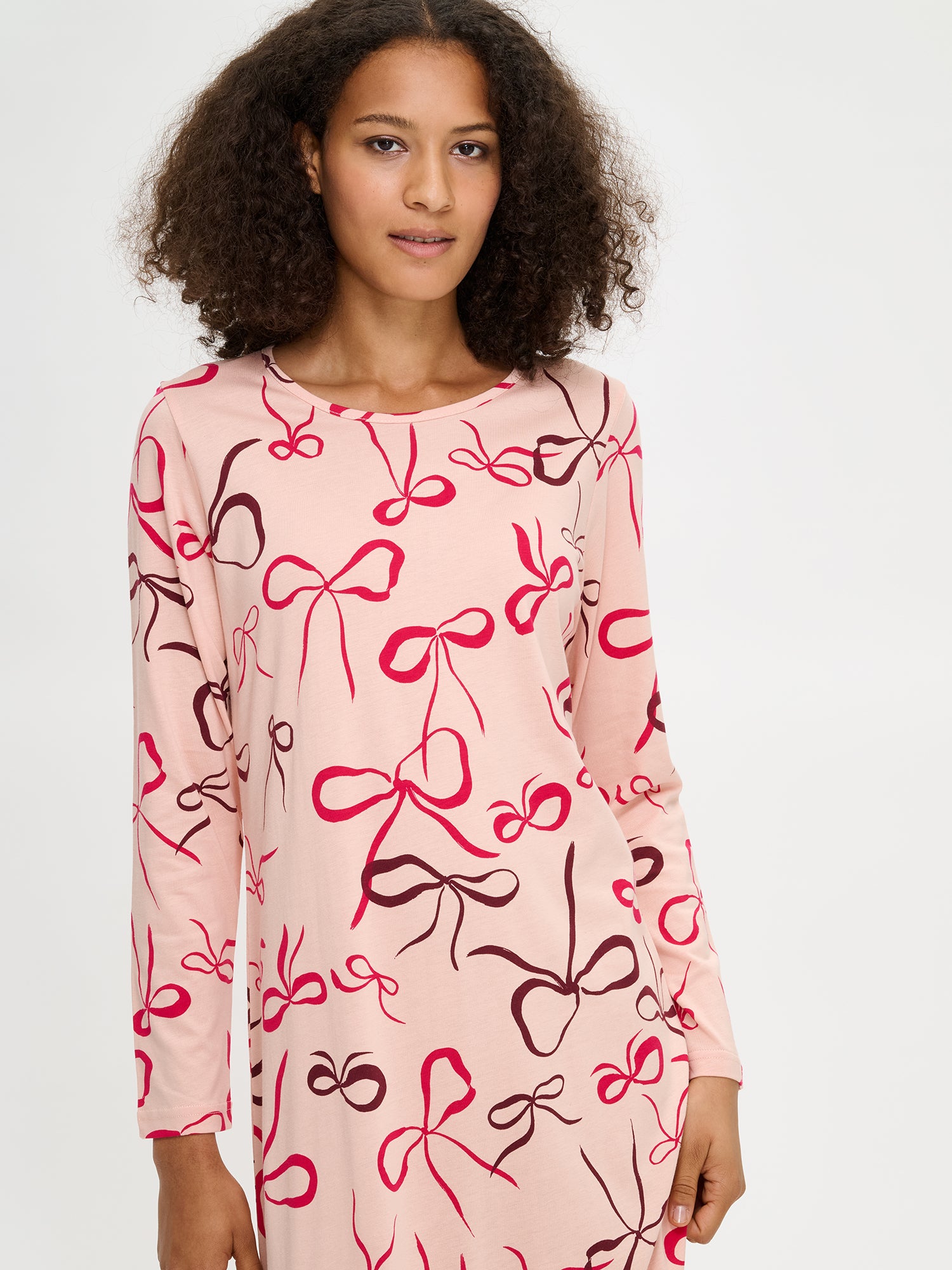 Rusetti nightgown in pink with long sleeves on a model.