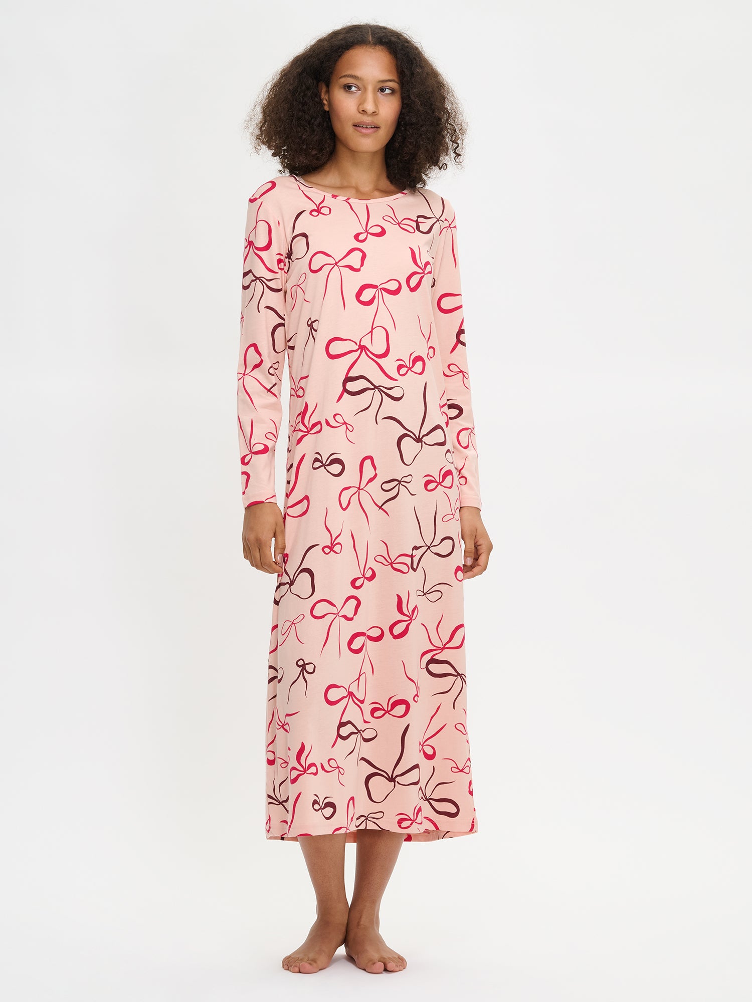 Pink Rusetti long nightgown on a model in the picture.