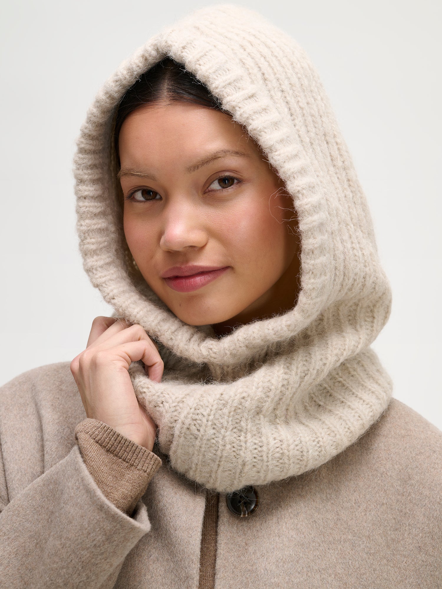 Nanso women's cozy beige Usva knit balaclava warmly covers both head and neck. 