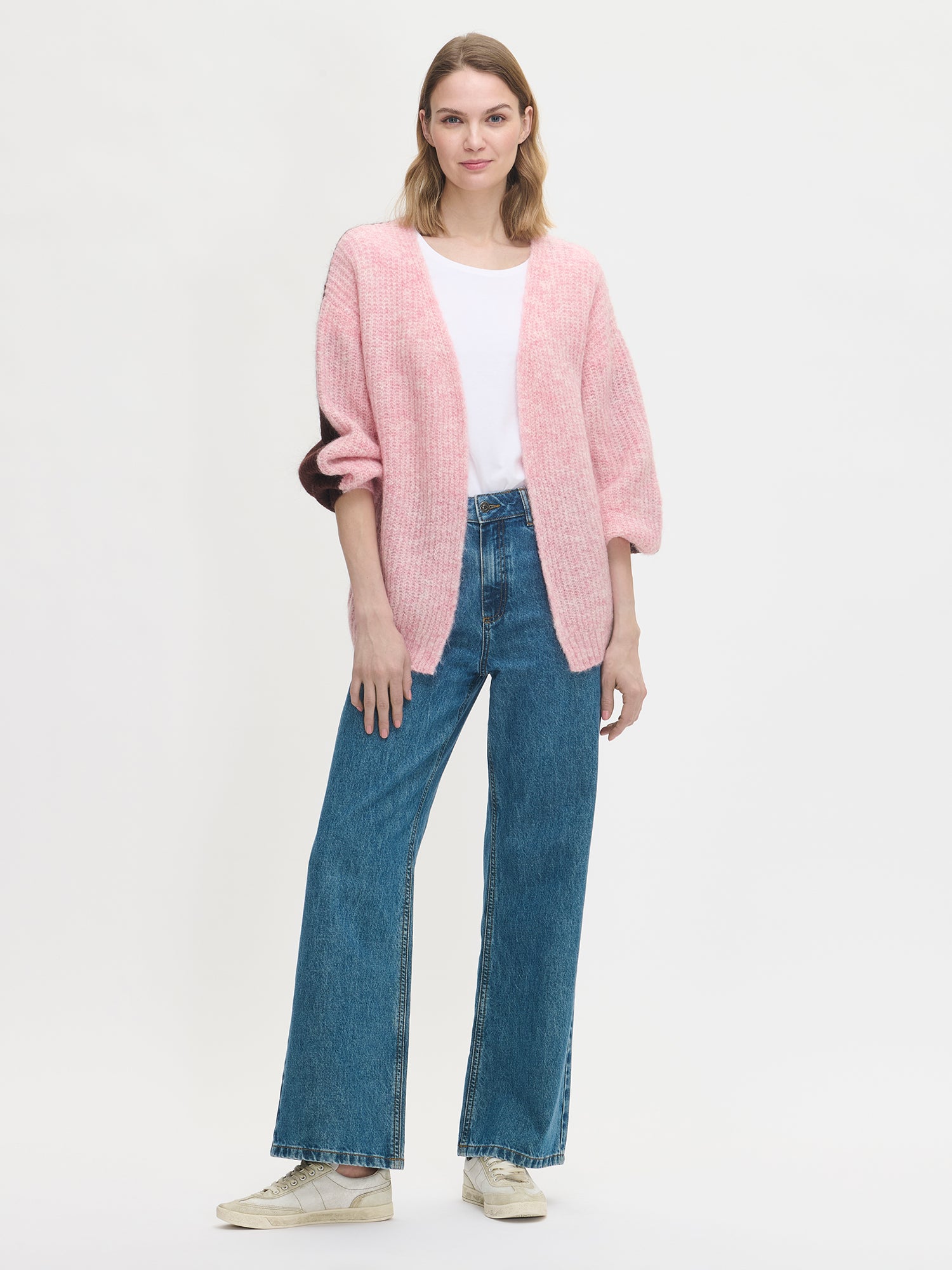 Nanso women's luxurious long-sleeved Karamelli knit cardigan in a soft pink-brown shade features contrasting colors on the front and back
