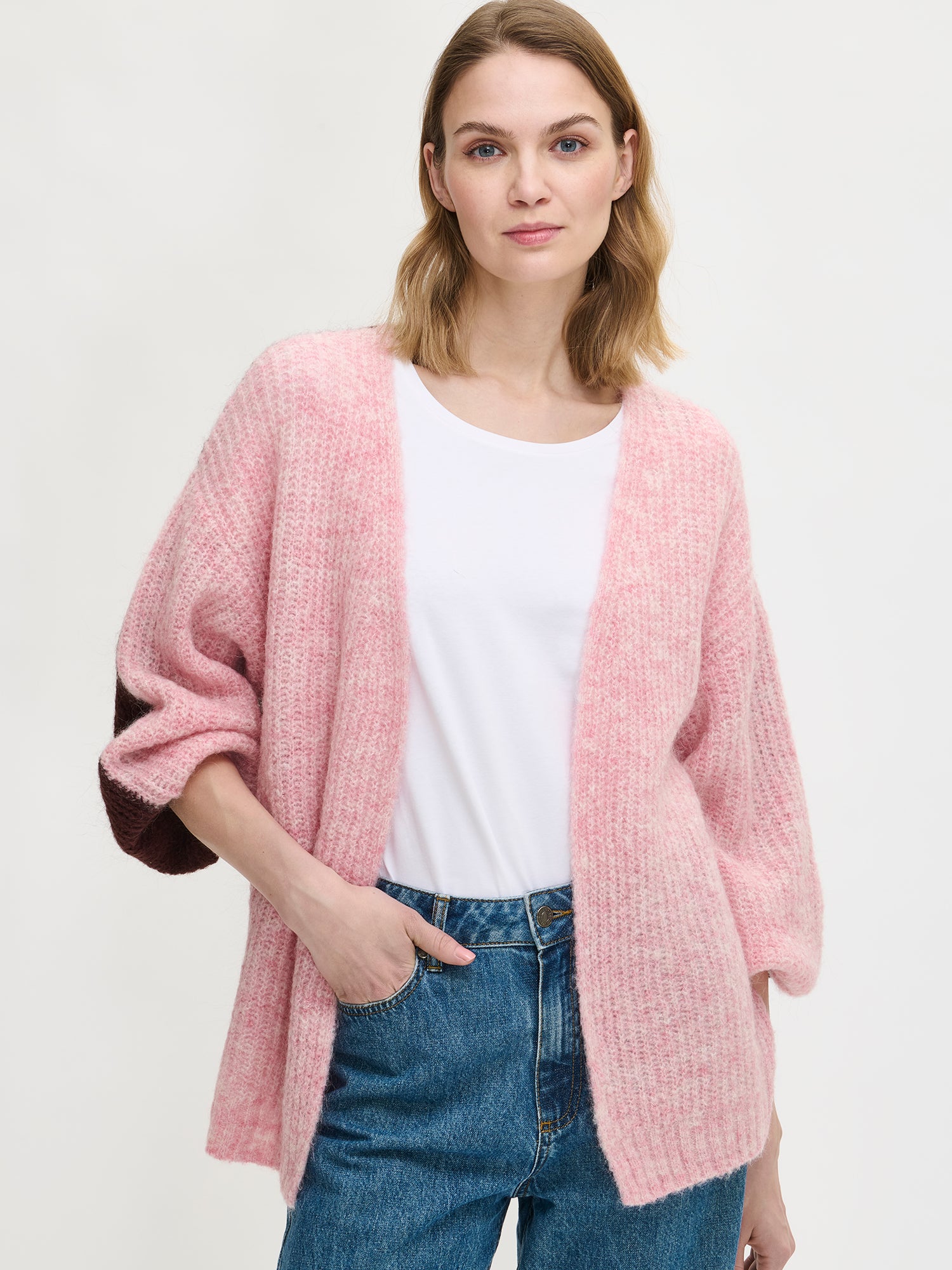 Nanso women's luxurious long-sleeved Karamelli knit cardigan in a soft pink-brown shade features contrasting colors on the front and back. Front
