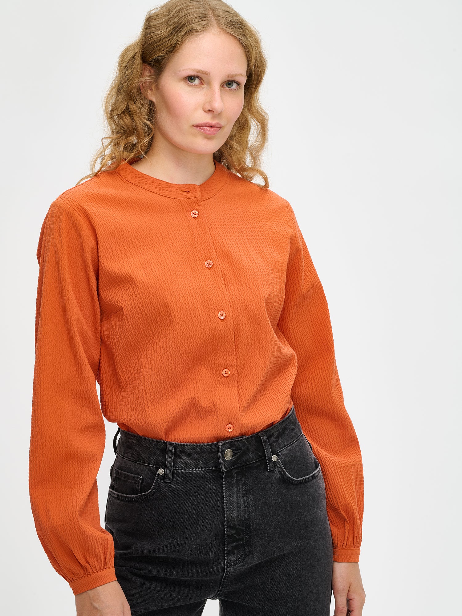 Nanso women's Bianca button-up shirt in orange, close-up