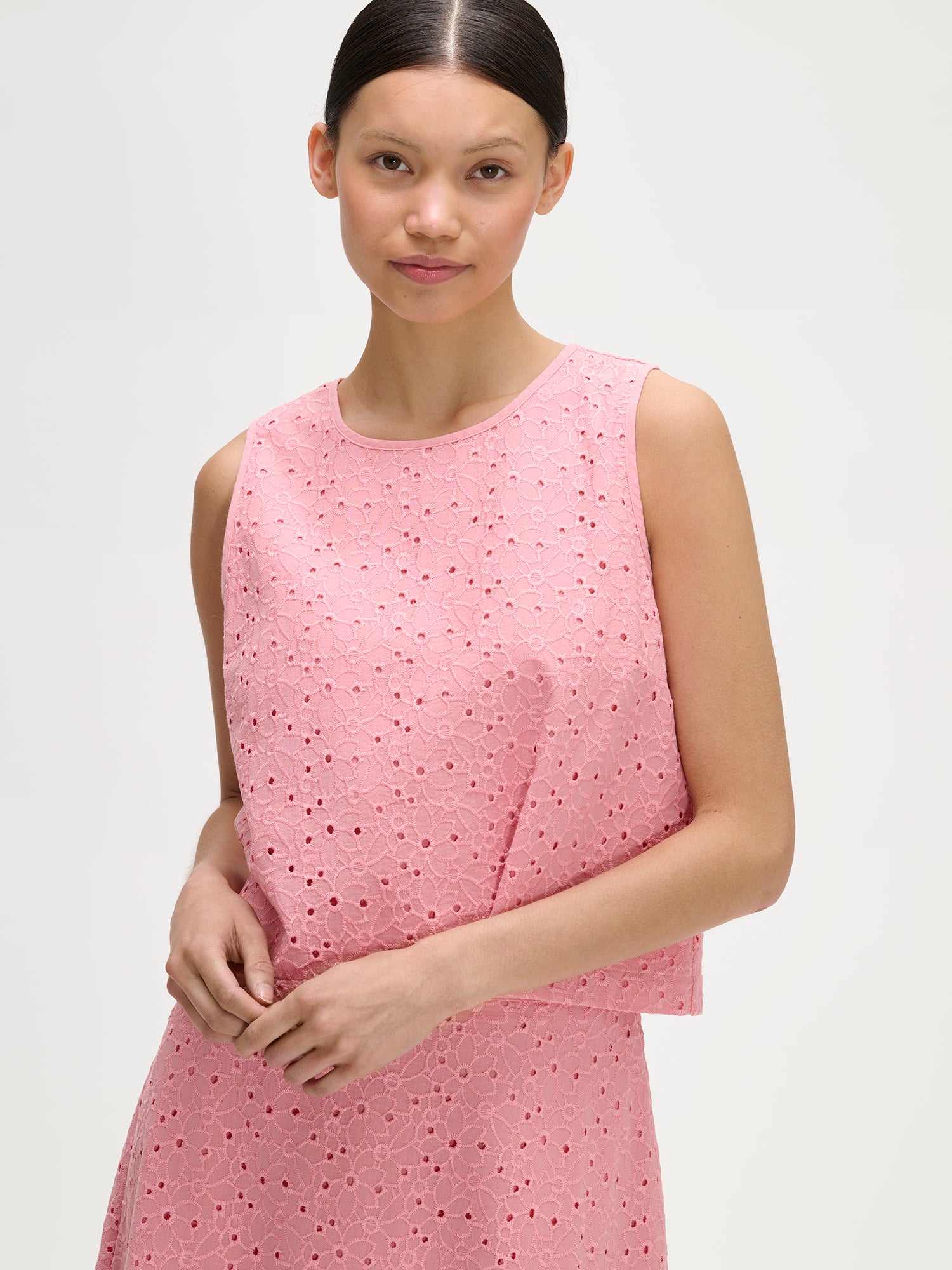 Nanso women's lovely NUPPU Embroidered Blouse in light pink on a model with a matching skirt, close-up.
