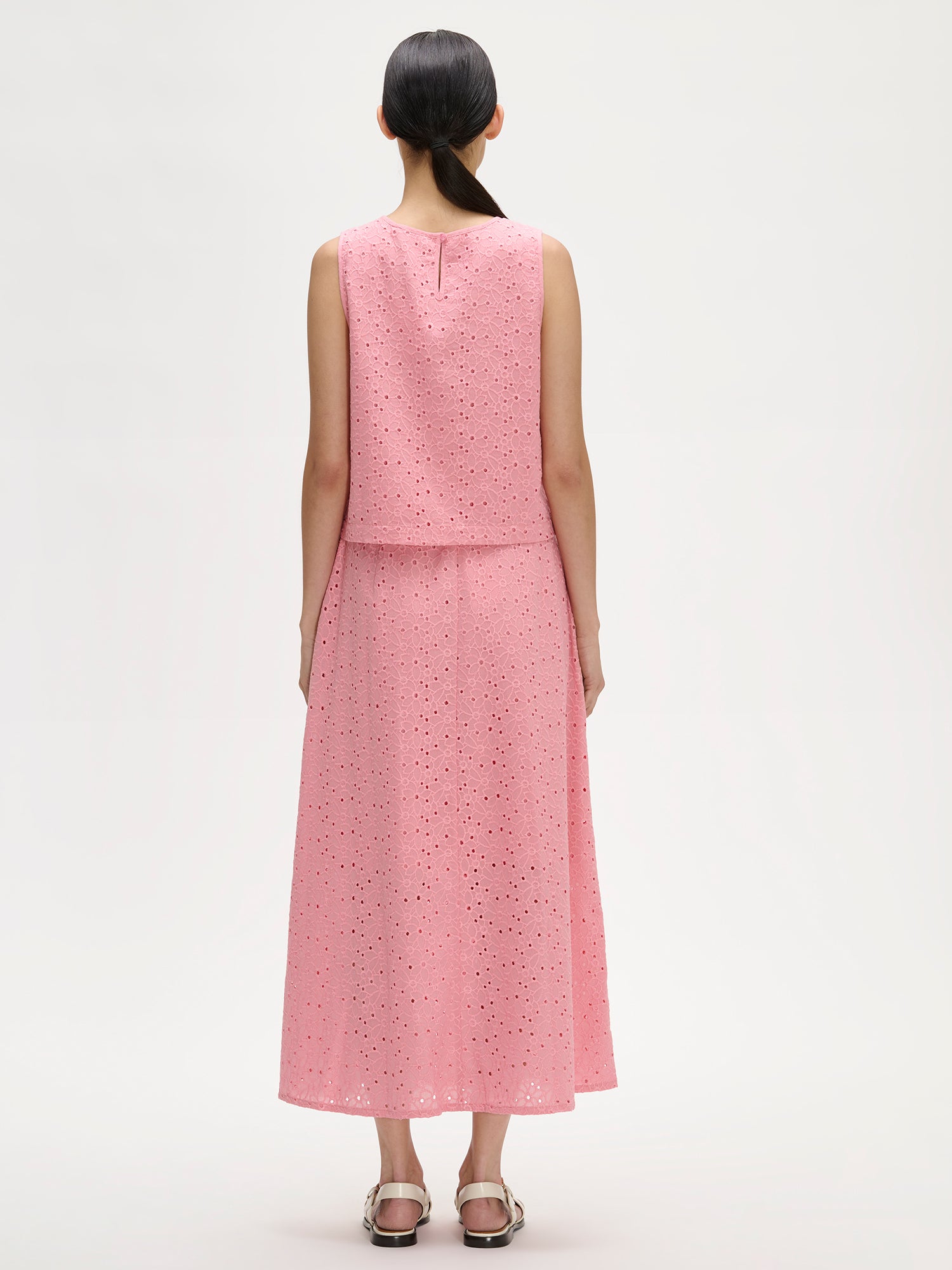 Nanso women's lovely NUPPU Embroidered Blouse in light pink on a model with a matching skirt, pictured from the backside