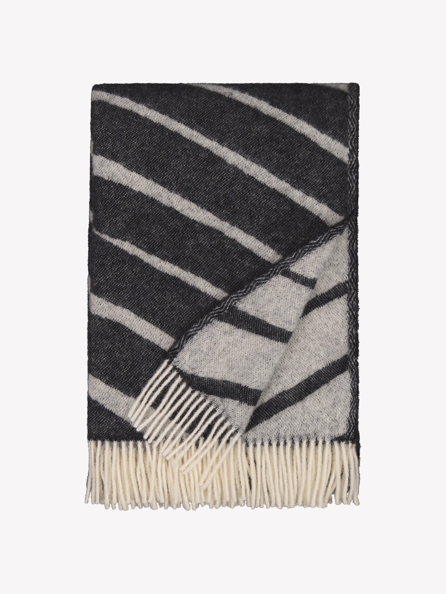 Laskos blanket in black with a striking graphic pattern and twisted fringes on the shorter sides in a product picture.