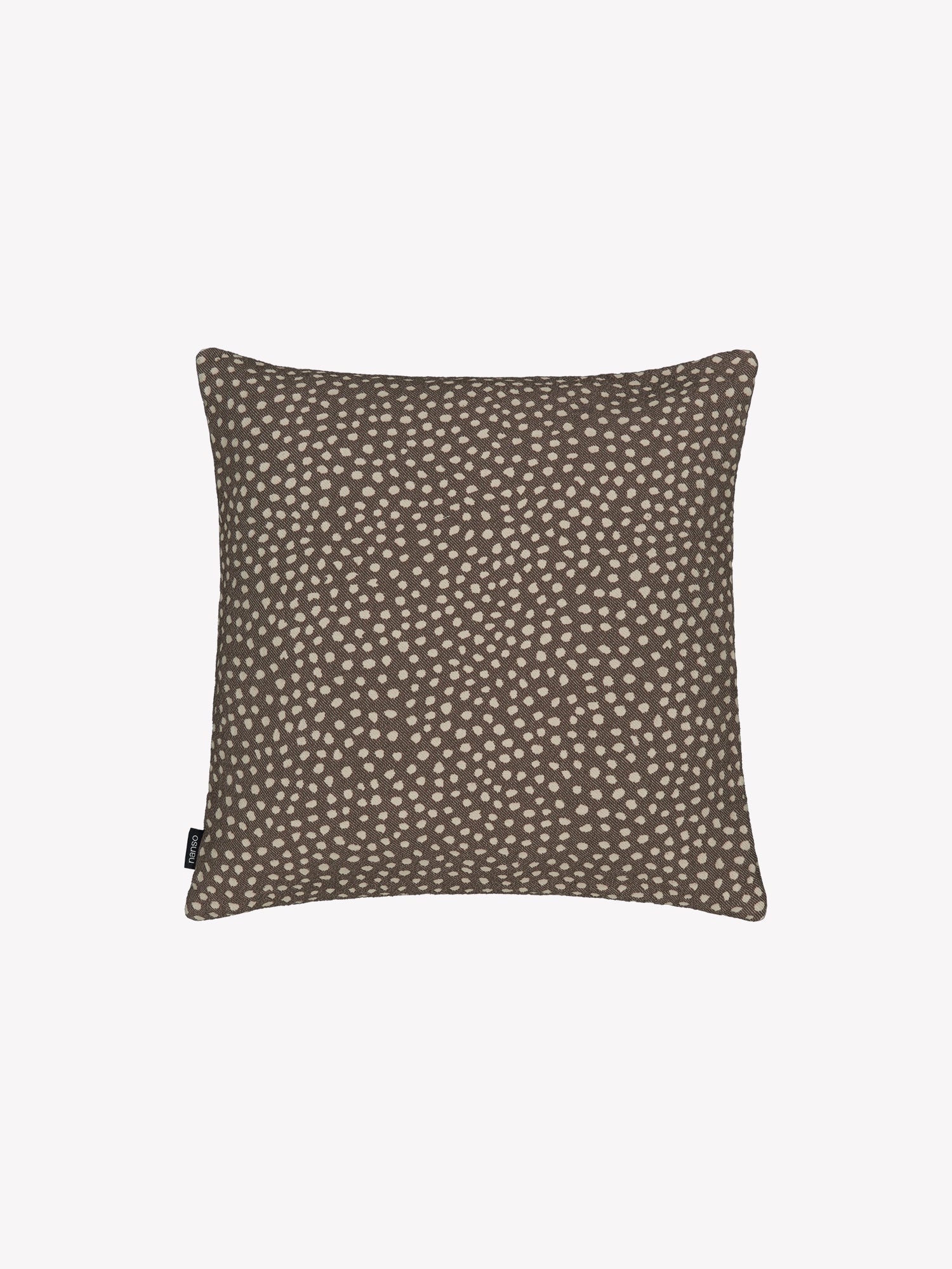 Muru pillowcase in brown features delicate black polka dots, in a product picture