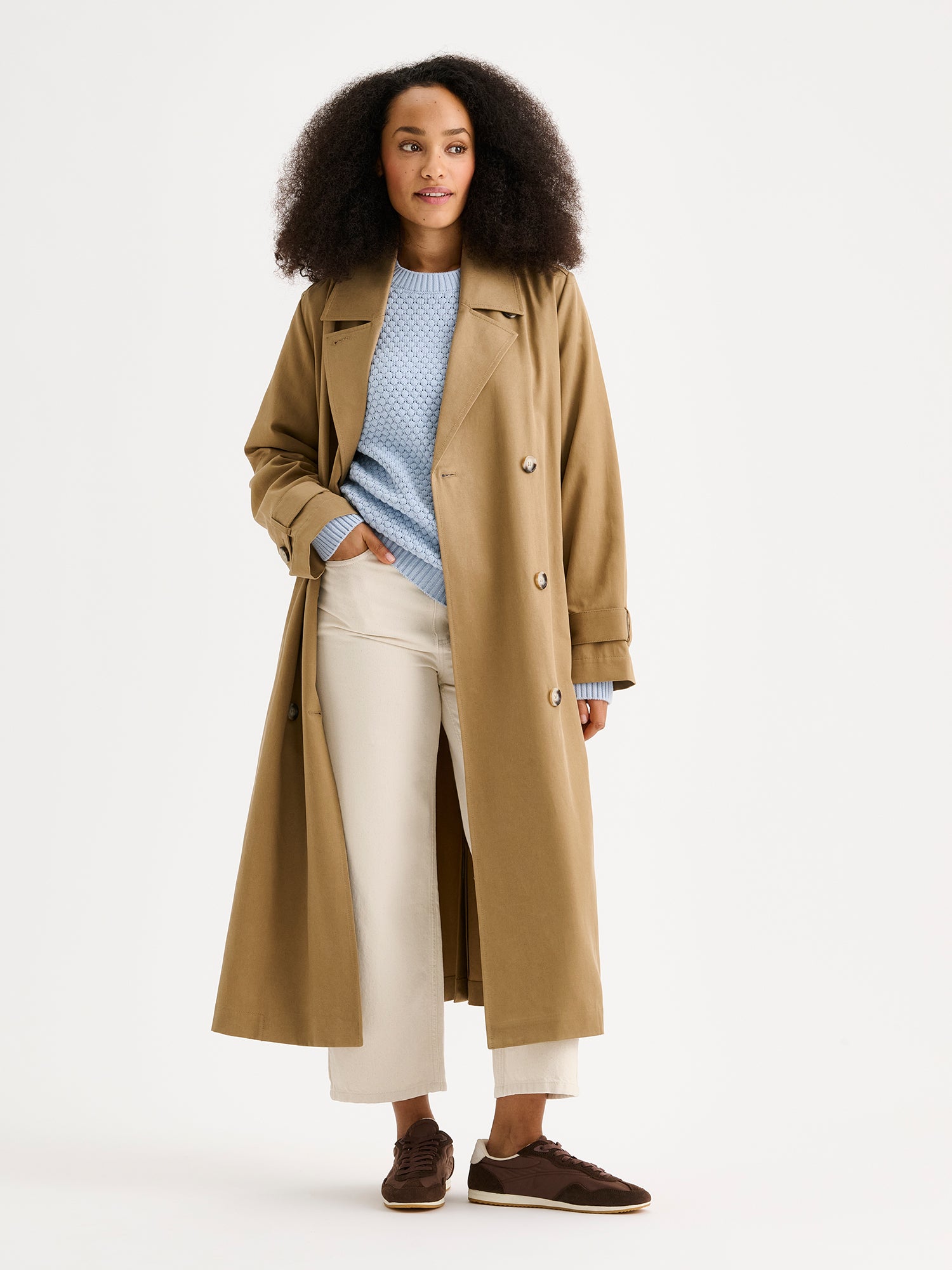 Nanso women's Klaara trench coat in brown on a model, the coat open