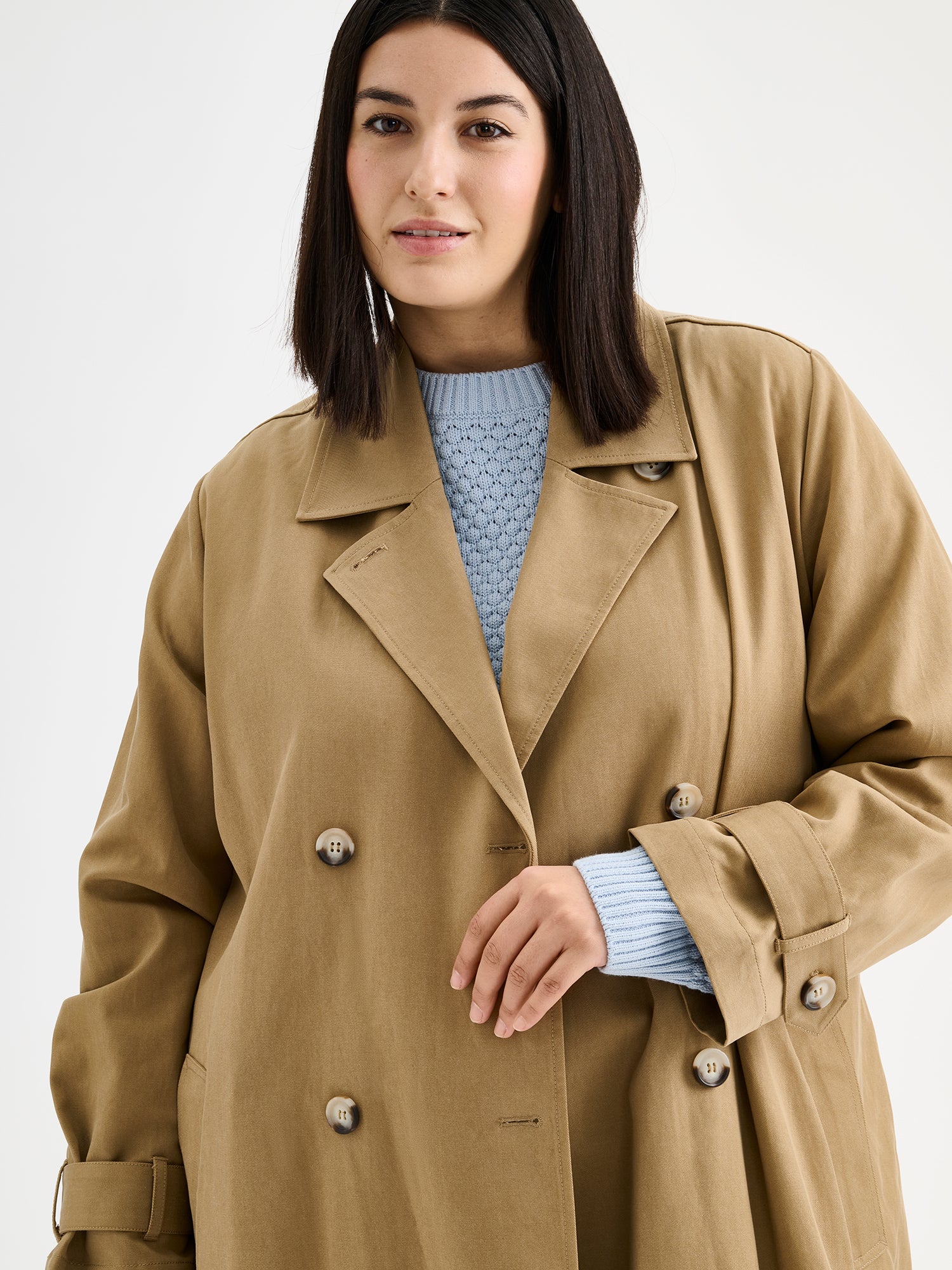 Nanso women's Klaara trench coat in brown on a model close-up.