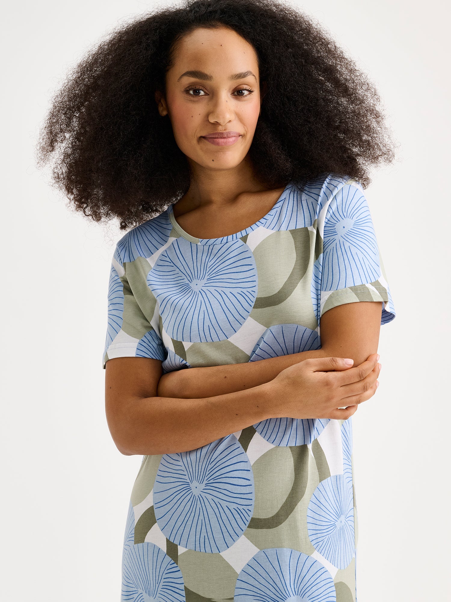 HEDDA Long Nightgown features a delicate blue-toned pattern. Pictured on a model, close-up.