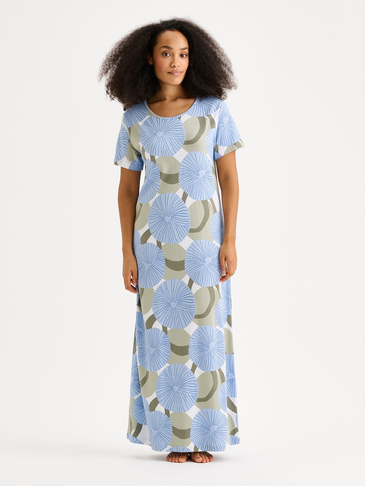 HEDDA Long Nightgown features a delicate blue-toned pattern. Pictured on a model.