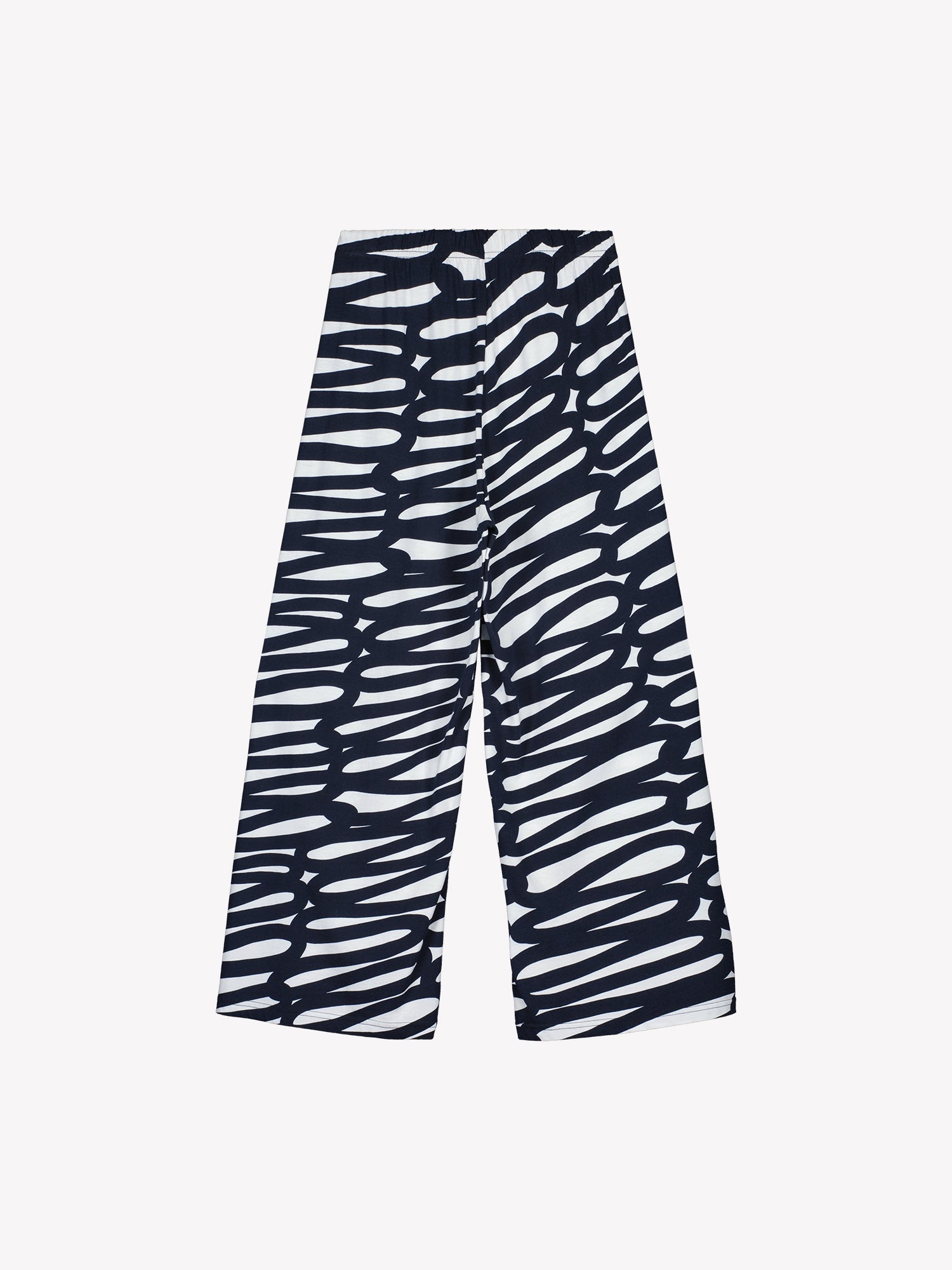 These women's lounge pants feature a striking two-tone pattern that catches the eye, paired with relaxed, wide-leg styling for effortless comfort. Pictured on a model with a white top. Product picture from the backside.