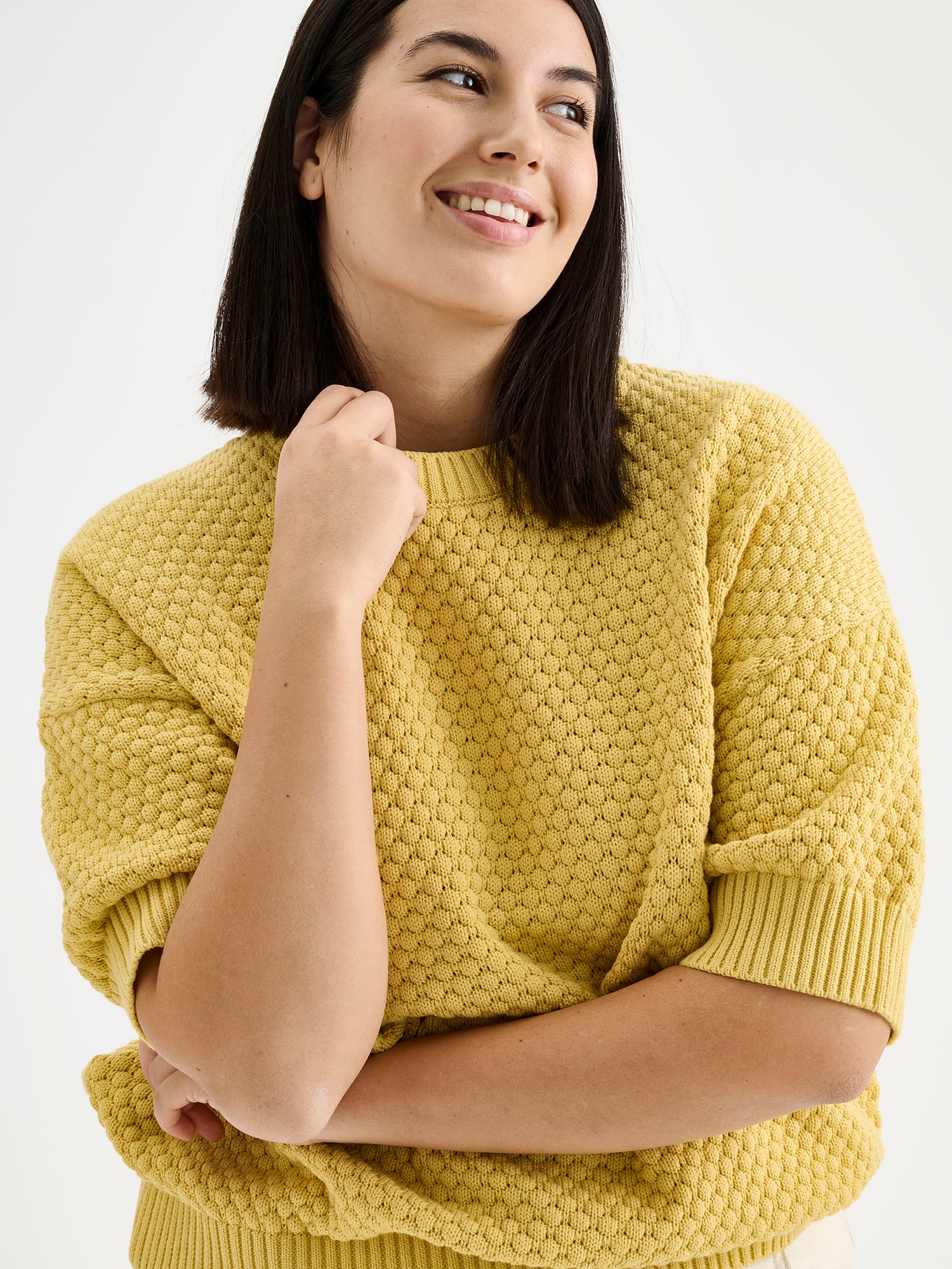 Nanso women's Kumpu versatile short-sleeved knit sweater in yellow on a model 