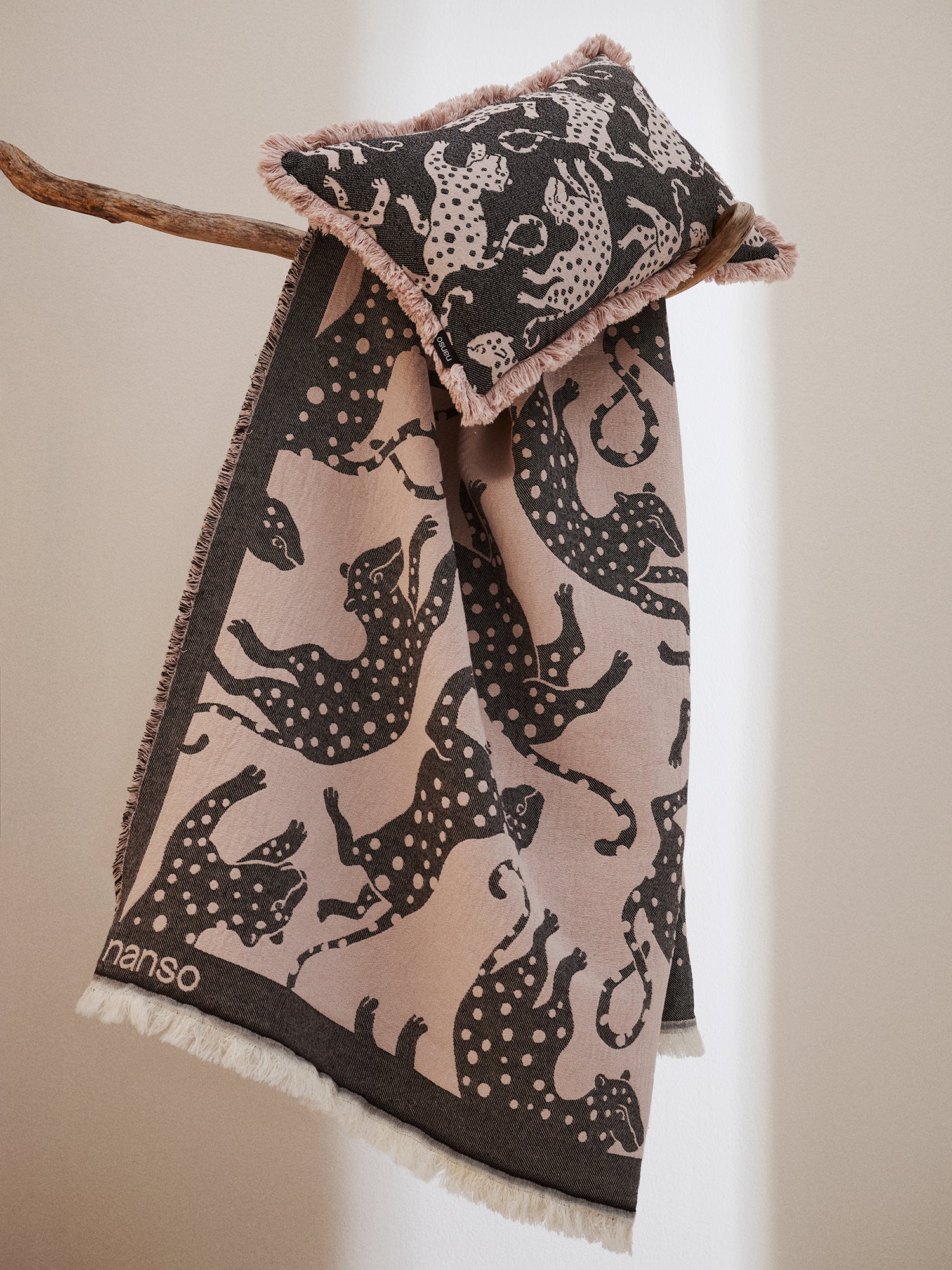 The black leopard-print Hapsu pillow case with a matching blanket.