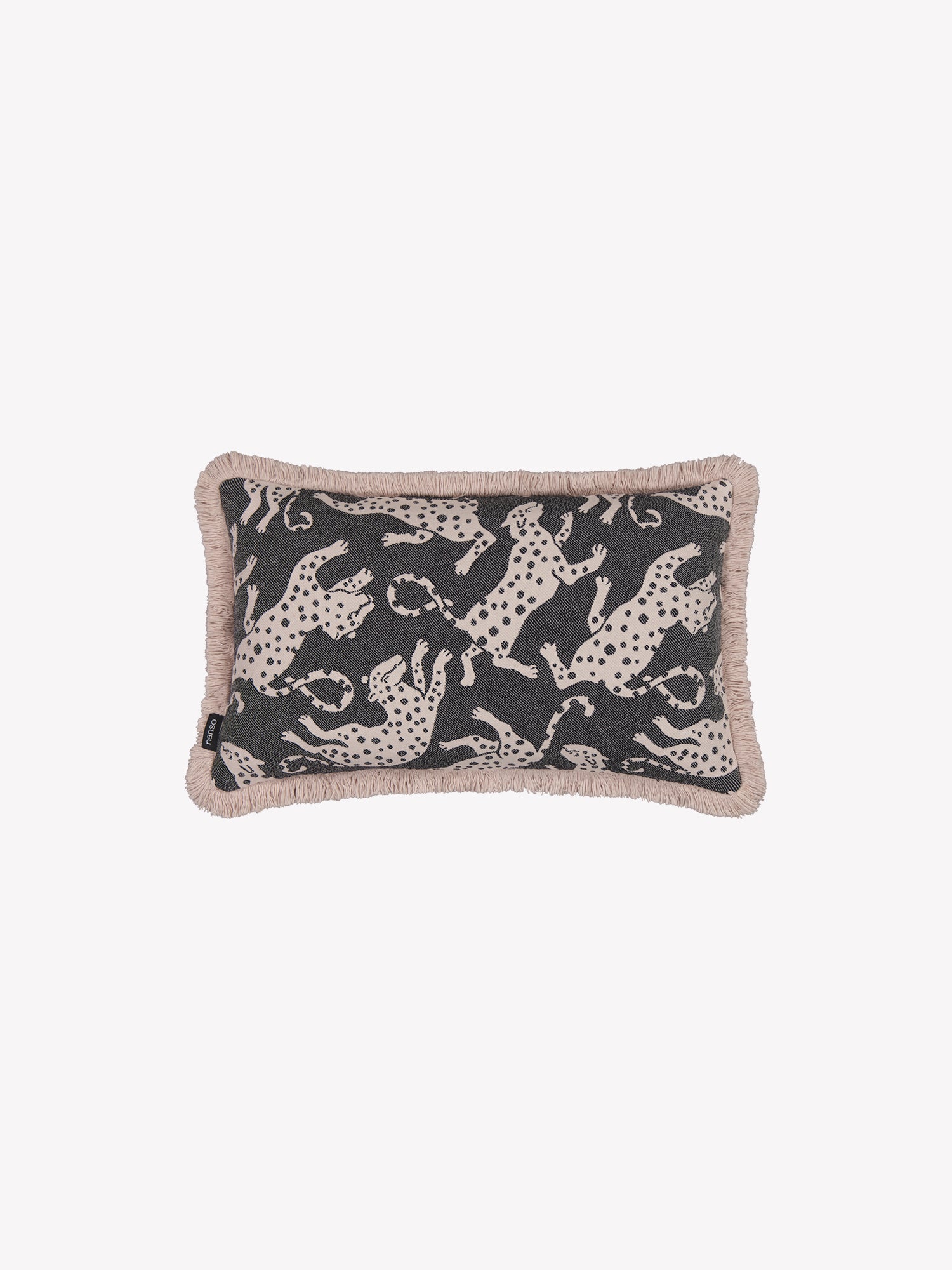 The leopard-print Hapsu pillowcase in a black shade with beige tassels along the edges in a product picture.