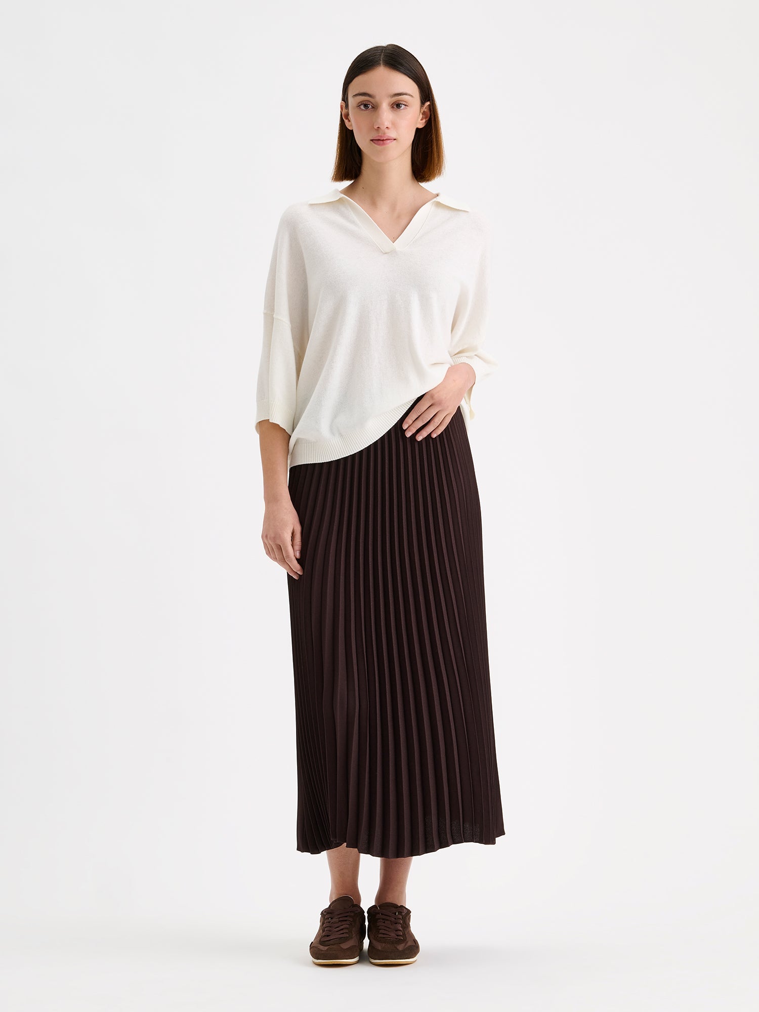 Nanso elegant midi length ARIEL Skirt in a trendy brown shade on a model with a white sweater | 36 - 173cm
