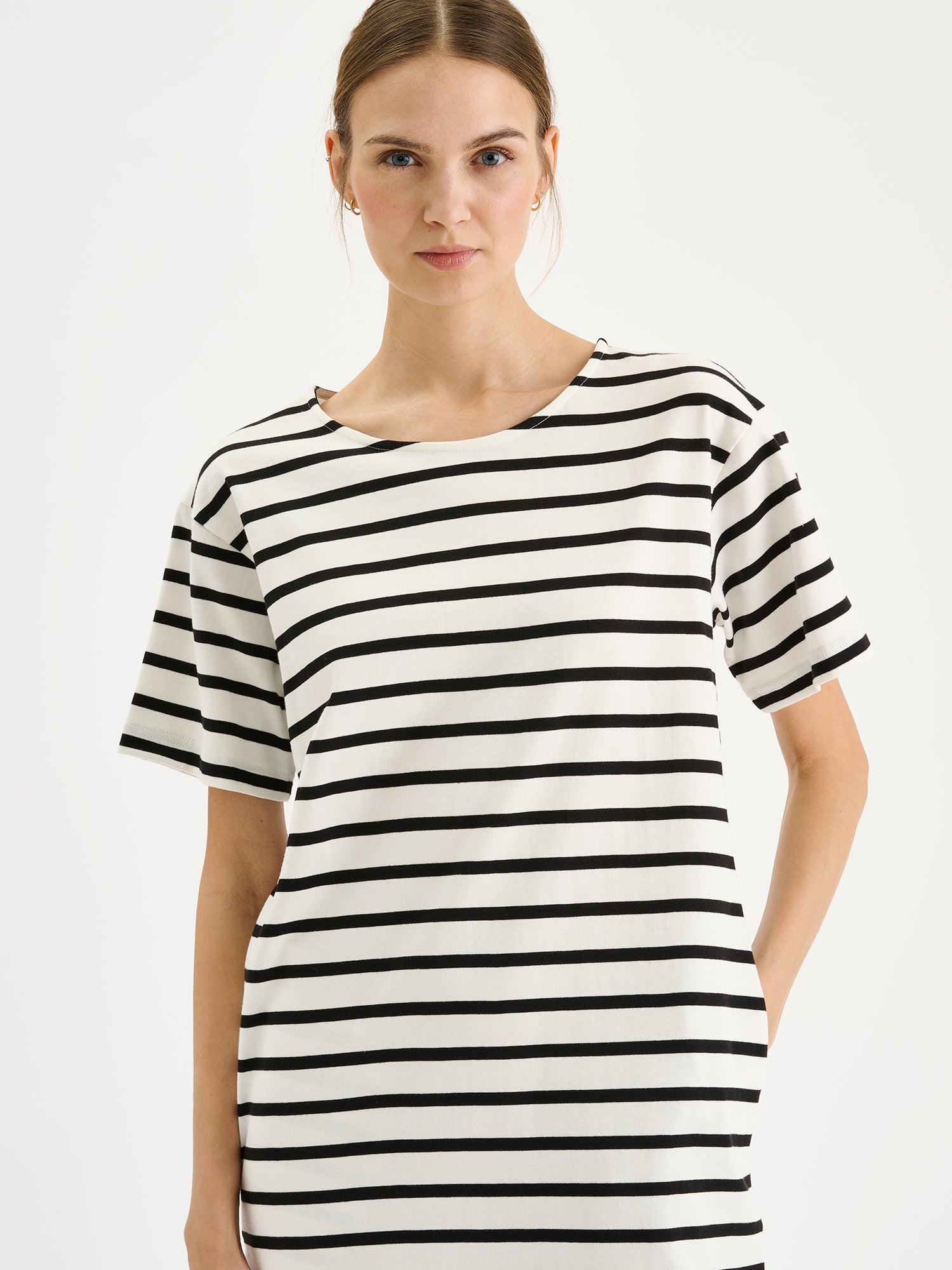 Nanso Breton classic black and white striped T-shirt dress on a model, close-up.