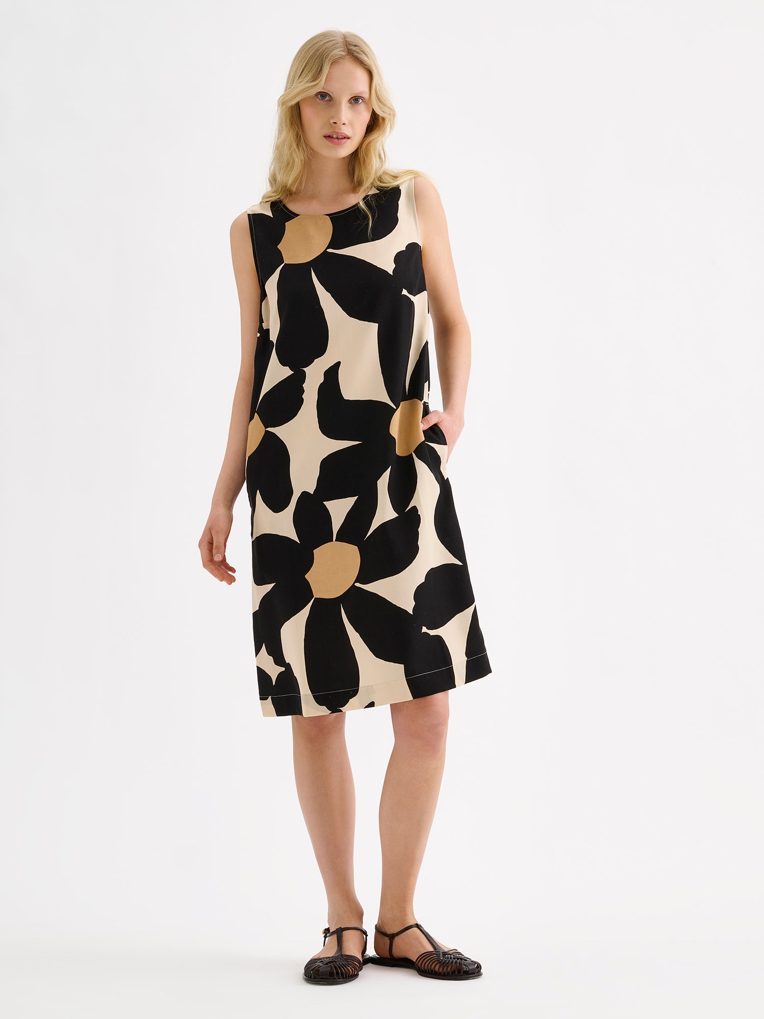 Nanso women's patterned sleeveless ROSI dress on a model with black sandals