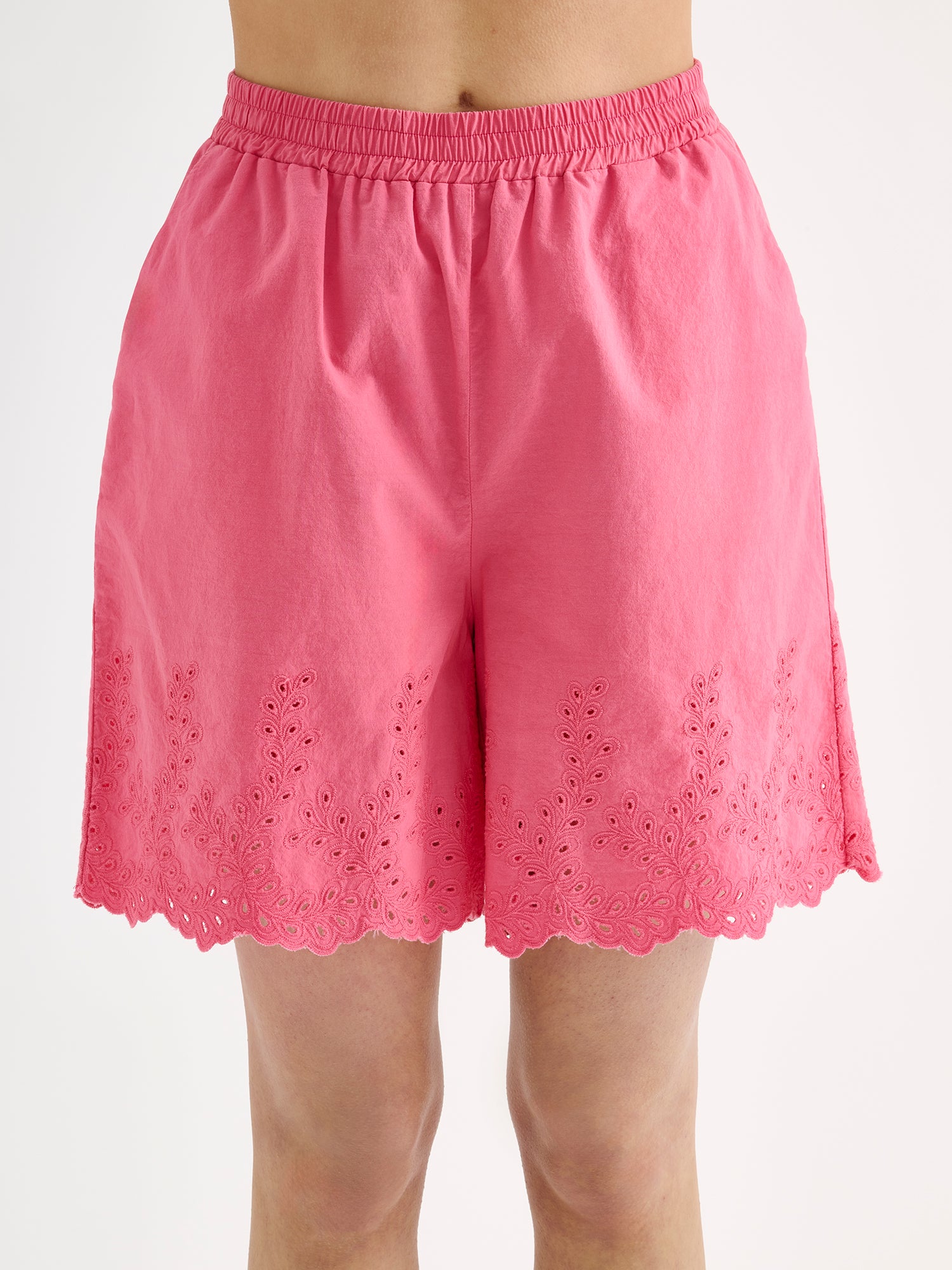 Nanso women's pink Sevilla shorts with lace details on a model close-up.