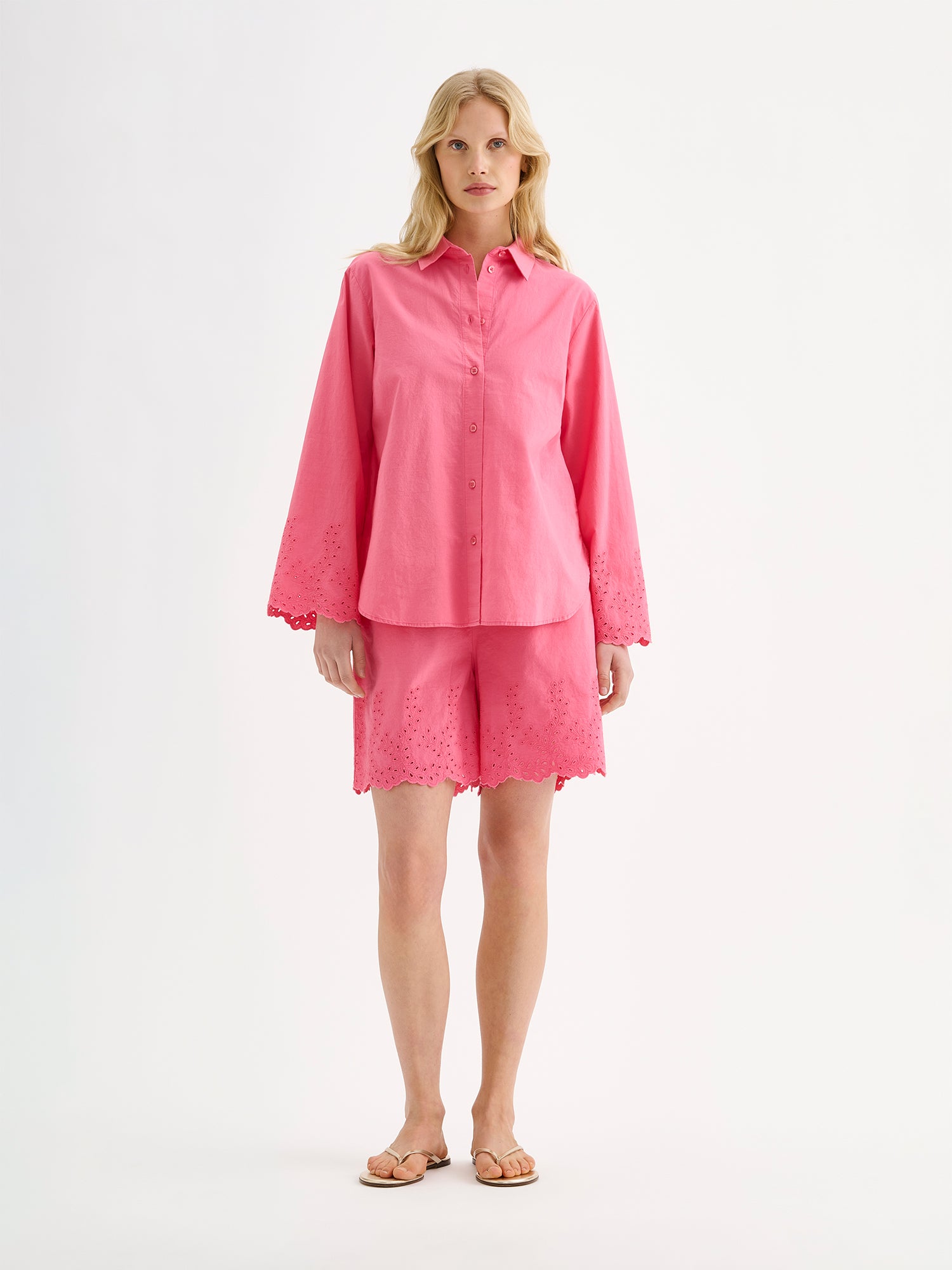 Nanso women's pink Sevilla shorts with lace details on a model with a matching shirt on.