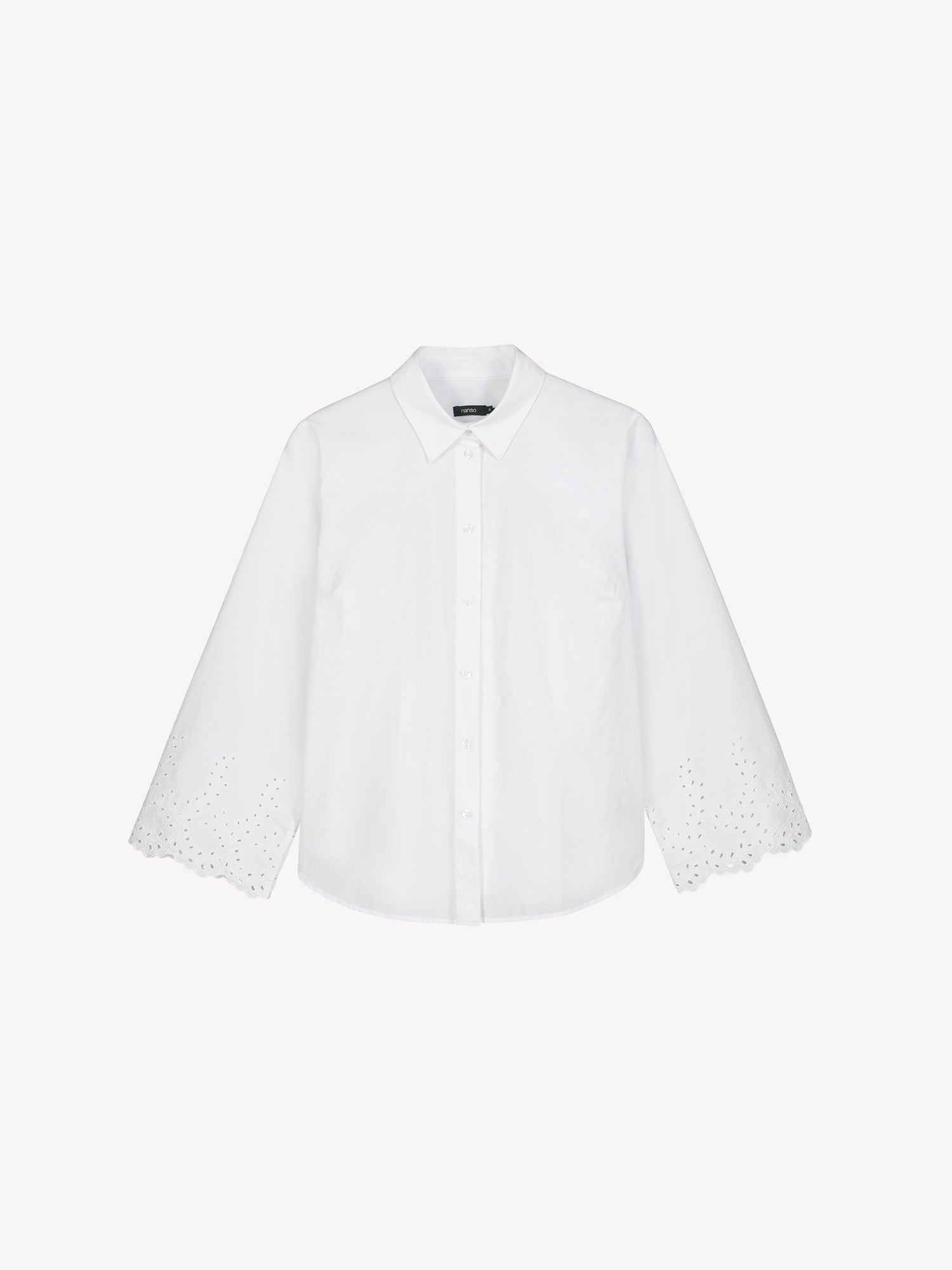 Nanso women's fresh white Sevilla shirt with airy, relaxed sleeves and delicate lace-trimmed edges, in a product picture