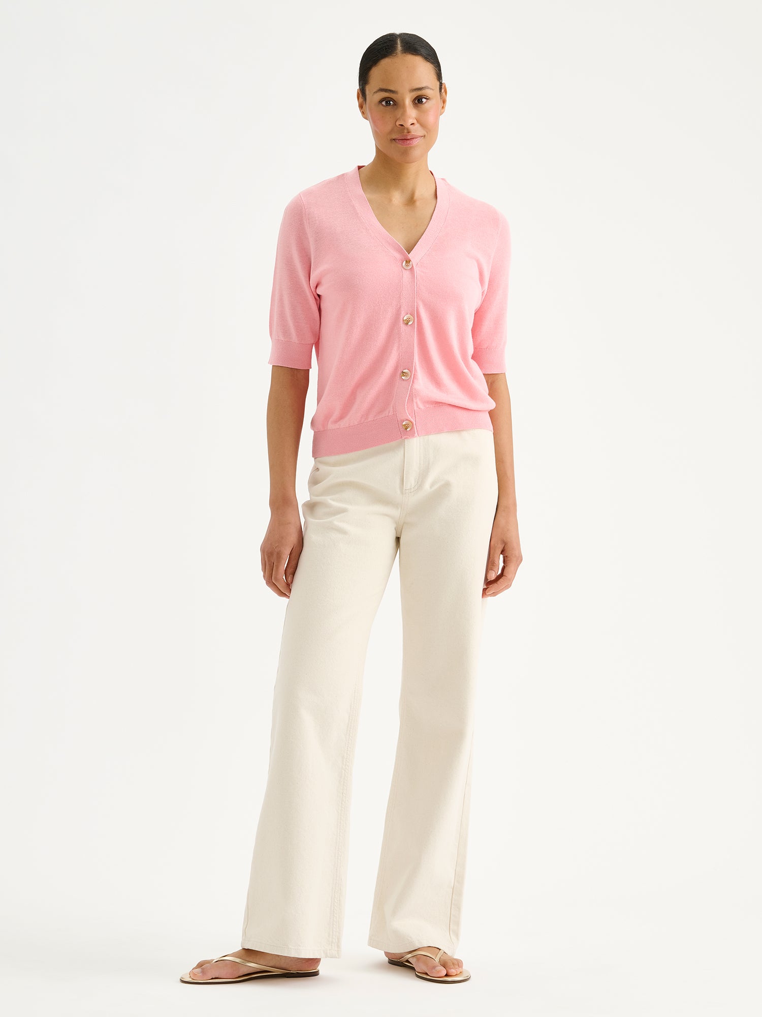 Nanso women's black half-sleeve linen blend Karina knit cardigan on a model with natural white jeans